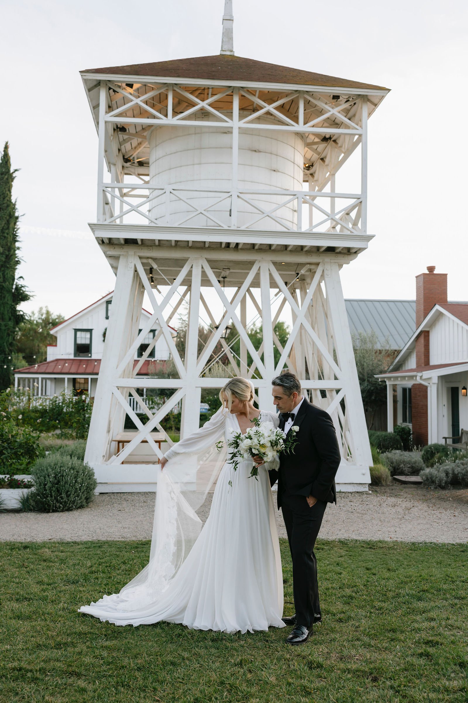 Bride and groom portrait near a historic tower at a Santa Barbara or Santa Ynez wedding venue, the Inn at Mattei's Tavern