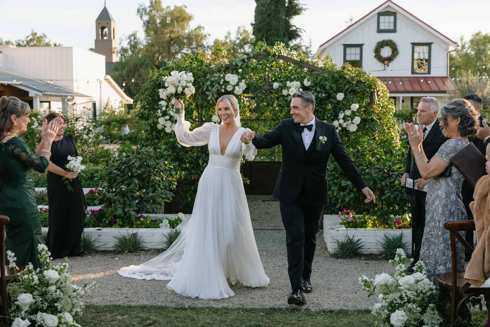 Golden-hour recessional on the Tavern Lawn at a Mattei's Tavern wedding