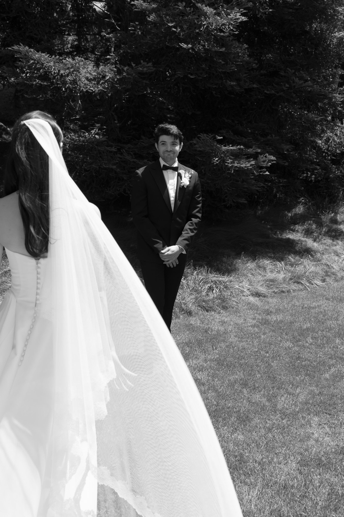 Black and white bride and groom first look photographed in a timeless documentary style