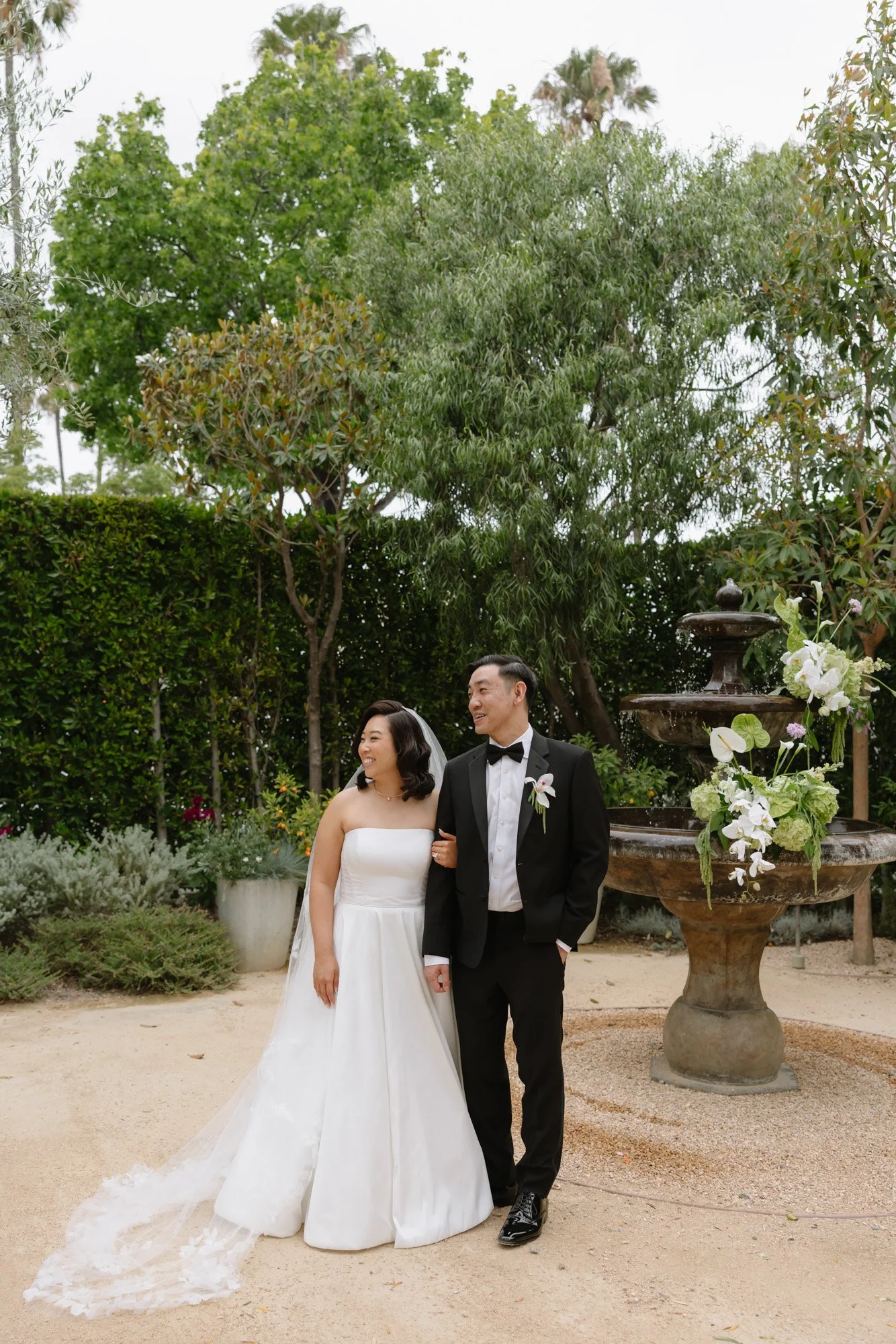 Bride and groom walking after ceremony at a garden wedding venue in California