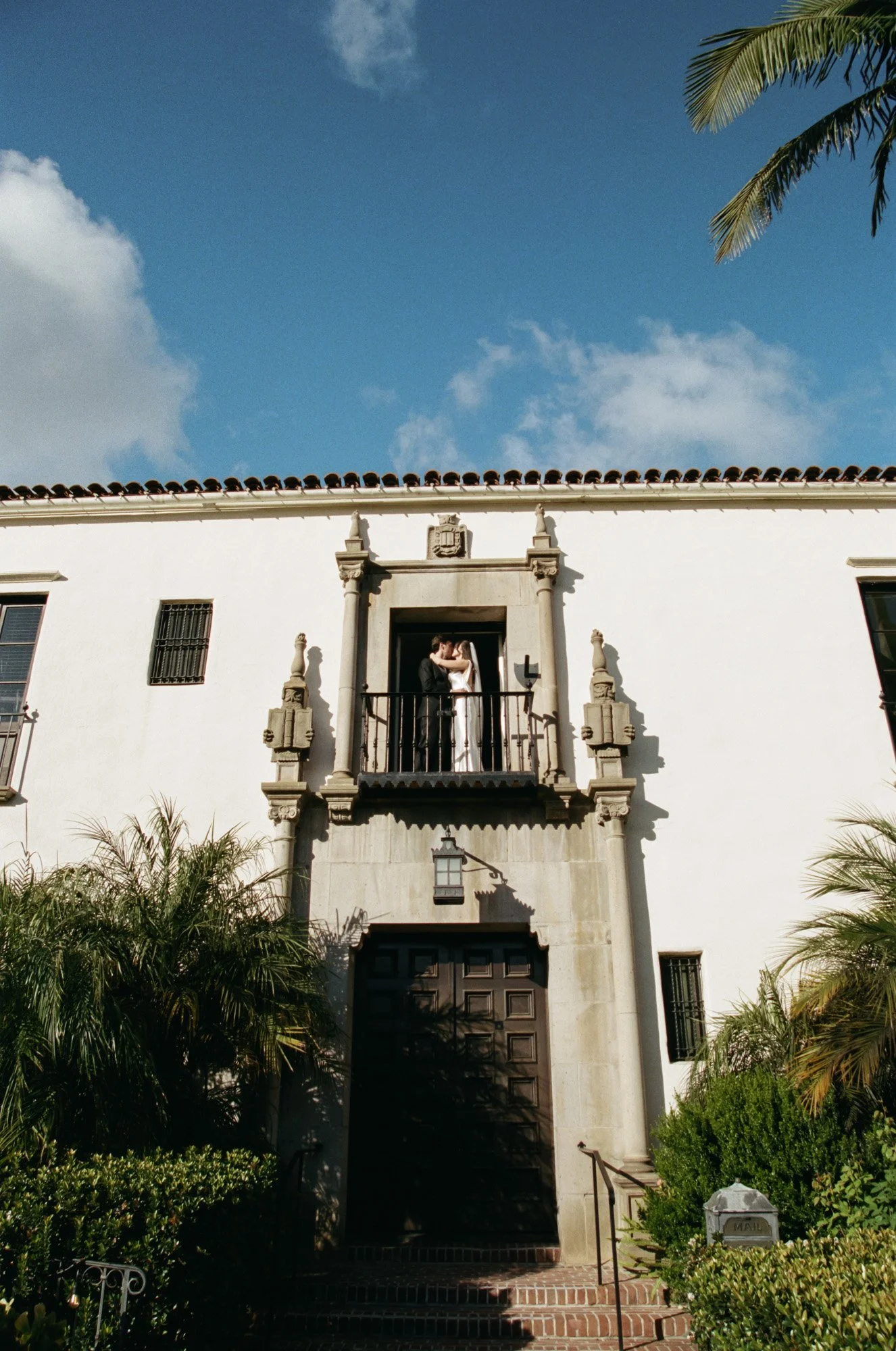 Historic Santa Barbara, California wedding venue exterior with Spanish-style architecture documented on film photography