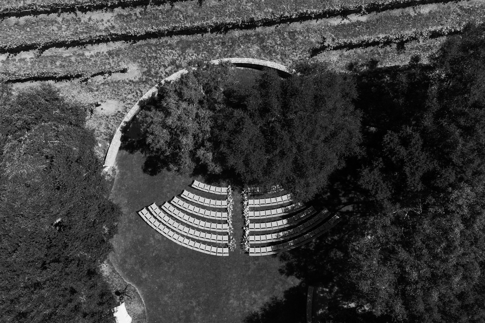 Aerial view drone photo of outdoor wedding ceremony seating in a garden setting at a California wedding venue
