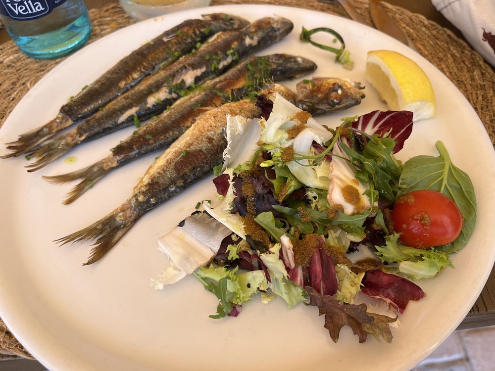 Lunch of grilled sardines
