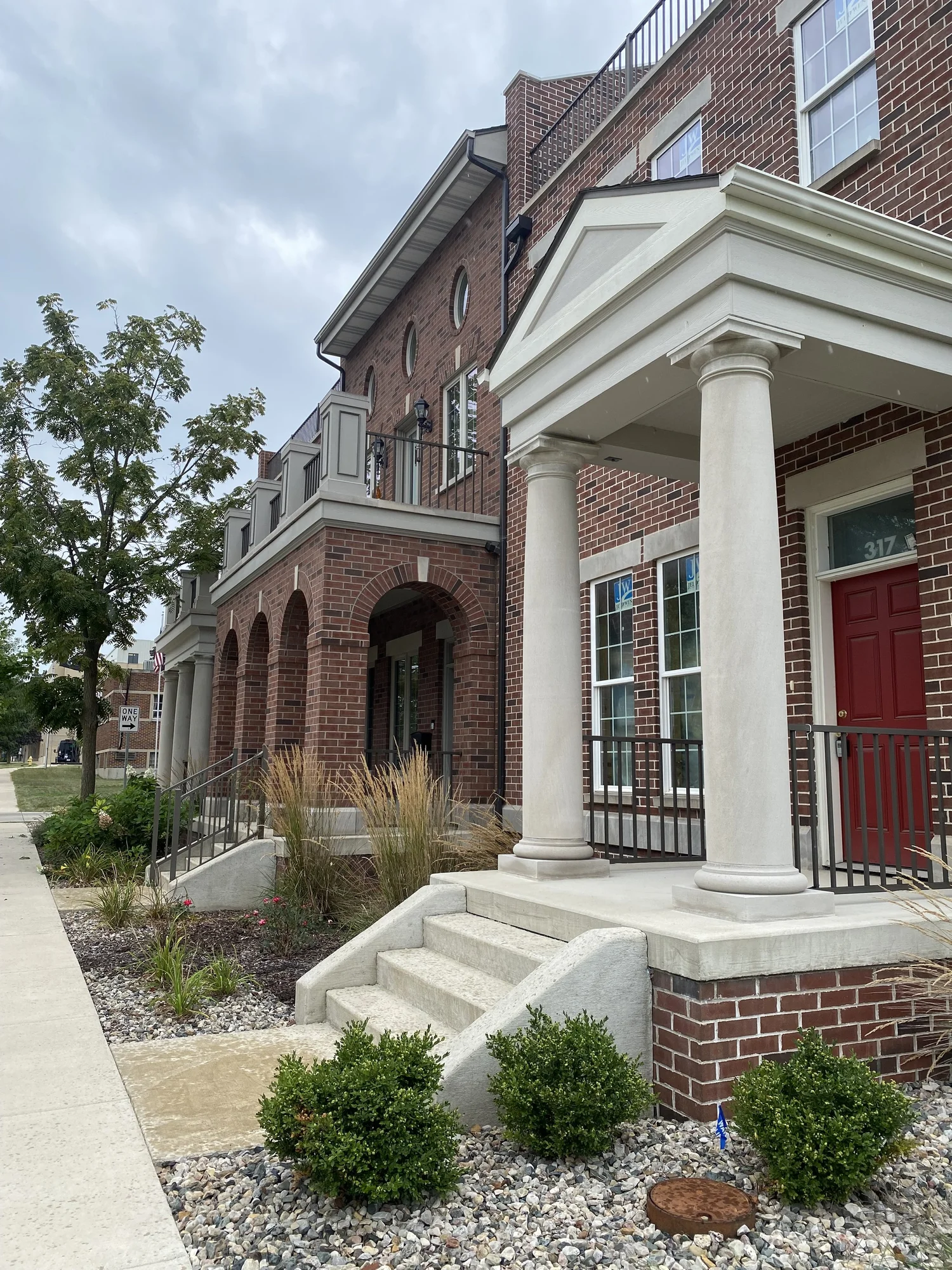 Warsaw Townhomes, brick townhomes with white columns near downtown Warsaw, Indiana