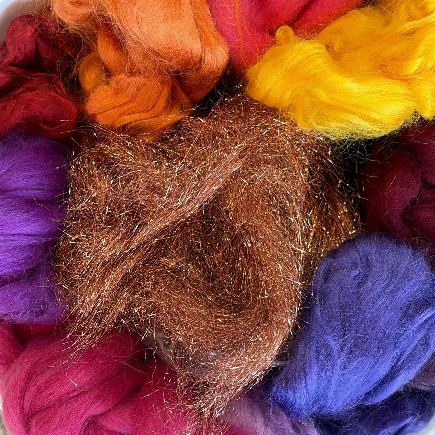 Assembling art batt ingredients for a new piece worthy of a silent auction. #wearableart #wetfelting