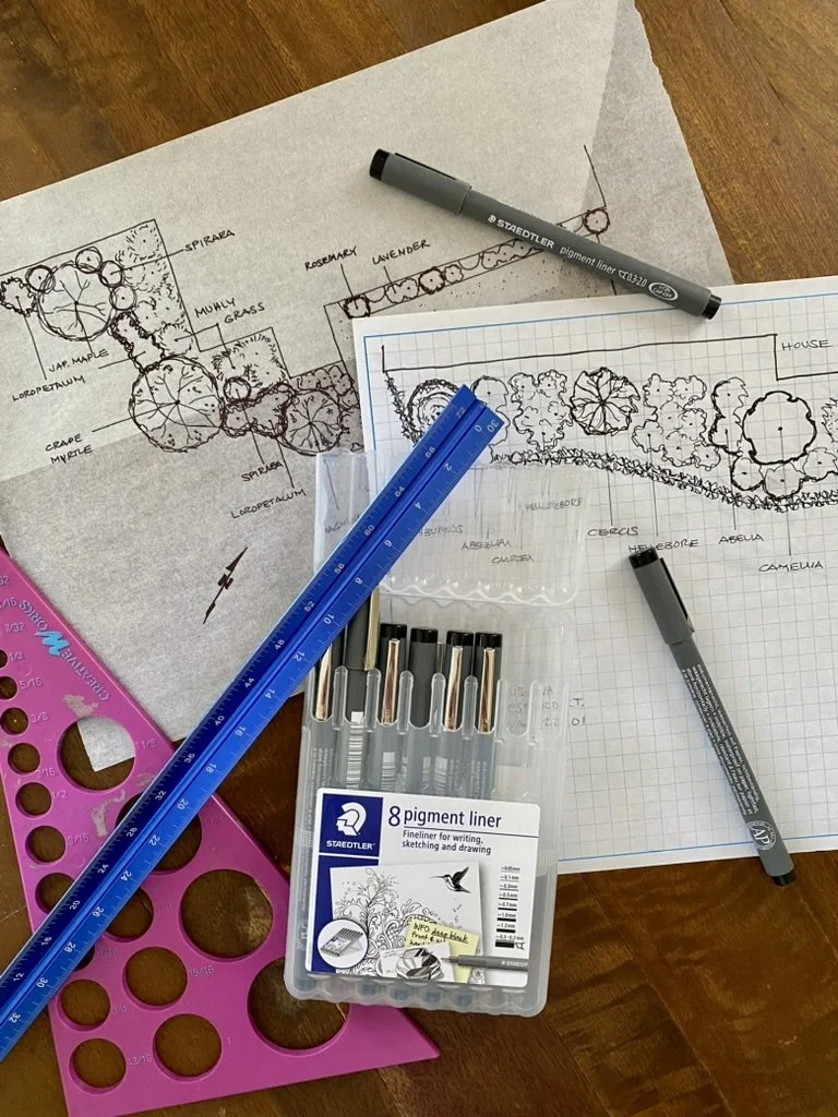 Landscape design sketches with markers and rulers.