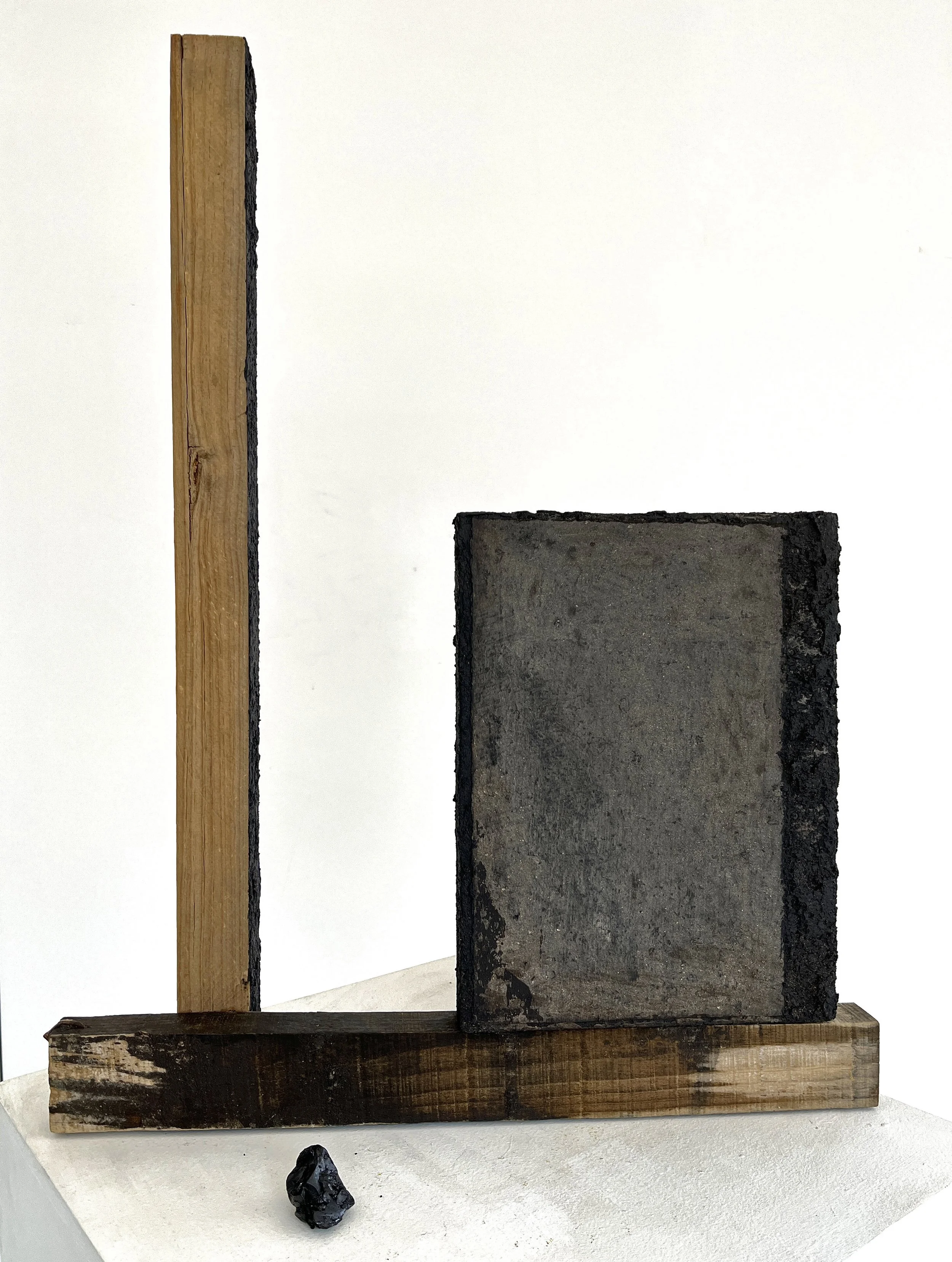 us - 28x20x6 in, reclaimed wood, tar, tar paper, earth, ink, chapapote, flame, 2024
