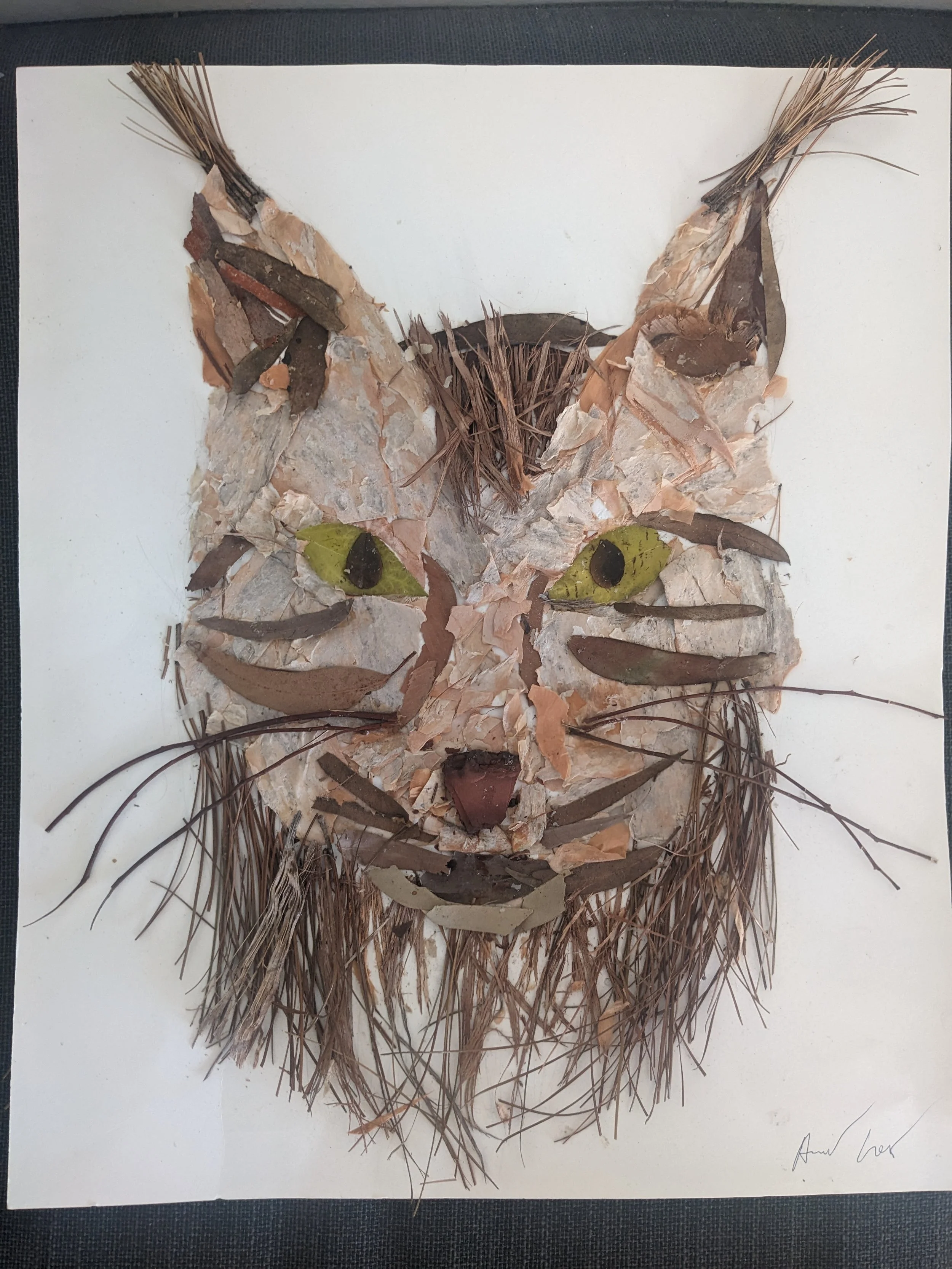'Collage green-eyed lynx'. The forms and shapes are formed as a whole, leaf by leaf
