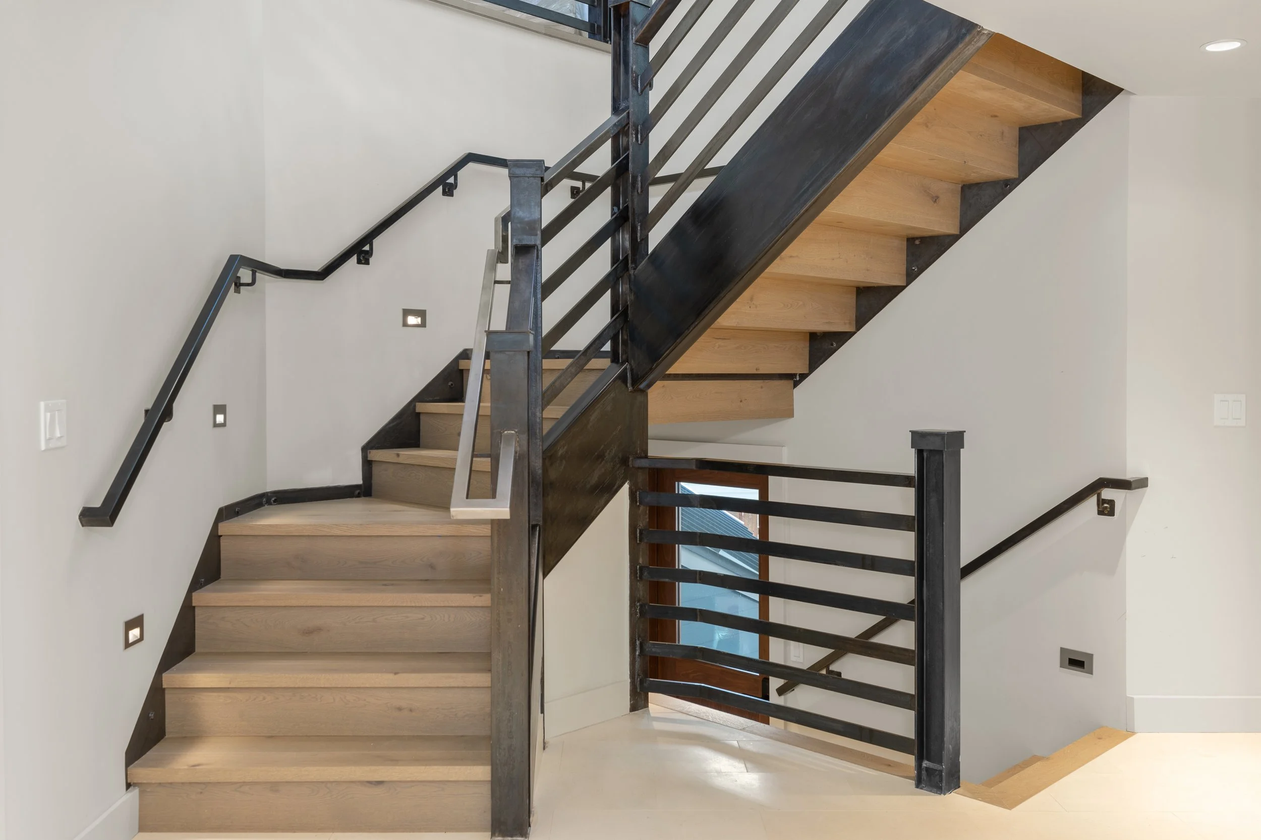 Custom blackened steel staircase with wood treads, Telluride, Colorado home.