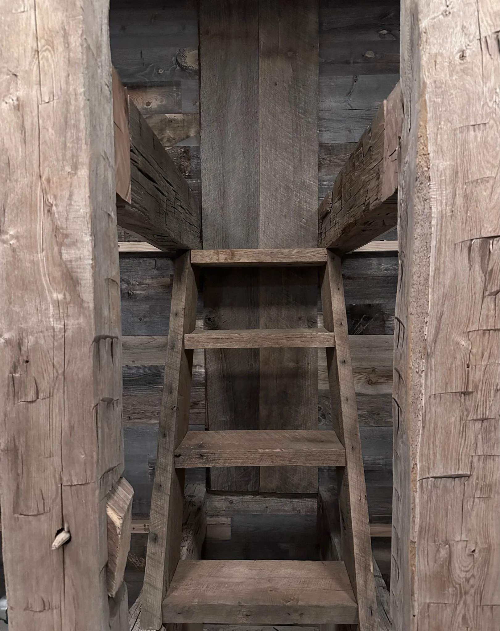 Handcrafted reclaimed timber ladder joinery detail in a custom Telluride, Colorado mountain home.