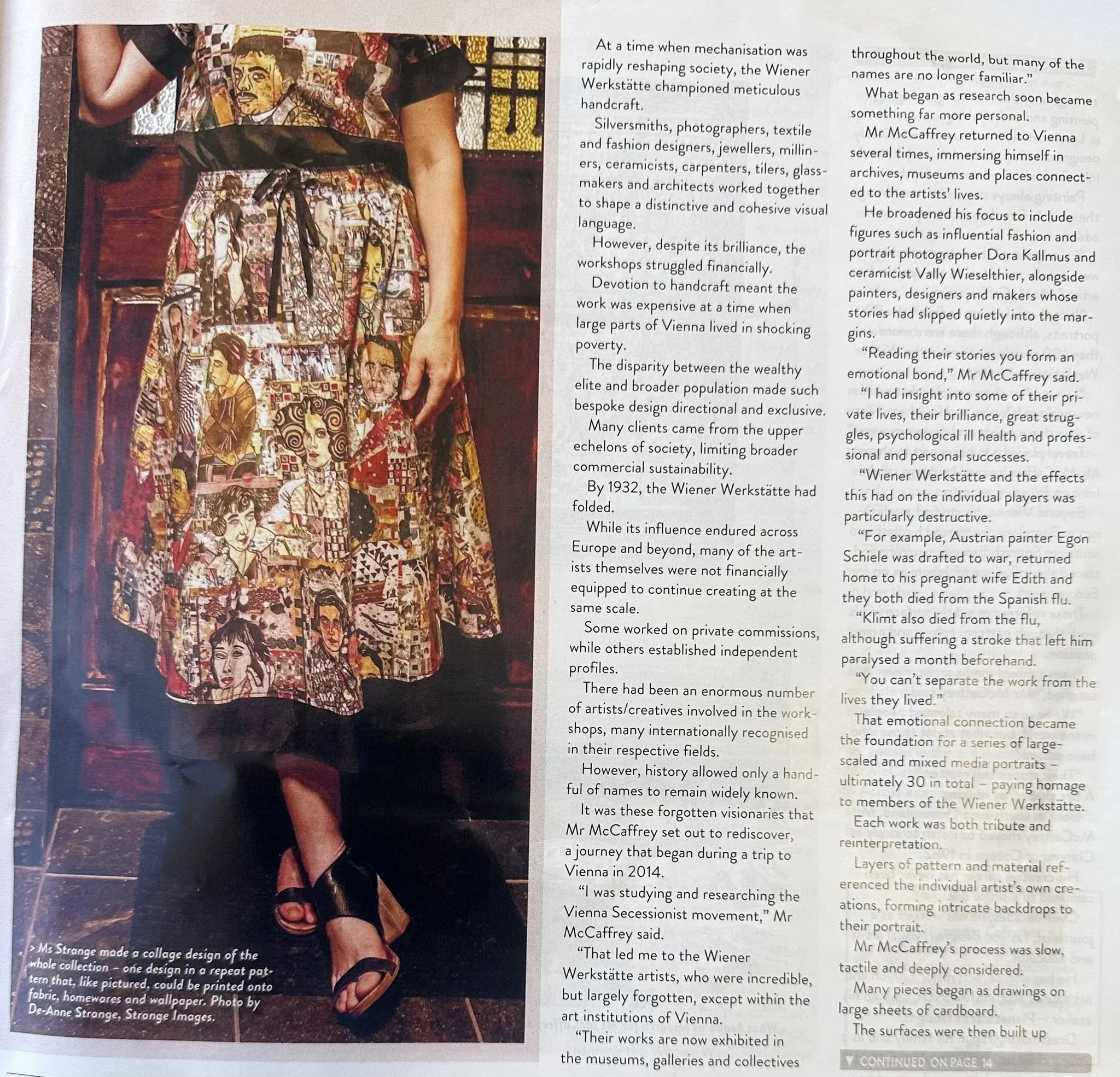 Close-up of a woman wearing a colorful dress with artistic portraits and designs, standing on a tiled floor, with part of her arm and foot visible.