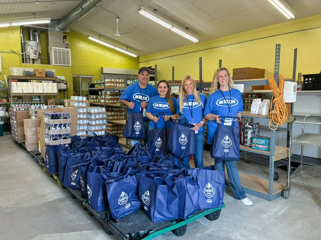   AMPI donated 40 burger meal bags, including Dinner Bell Creamery American cheese slices, to the Portage Food Pantry during the YC Summer Tour. Presenting the donation are, from left, Oscar Estrada, division manager; Domenica Barreno Loza, office as