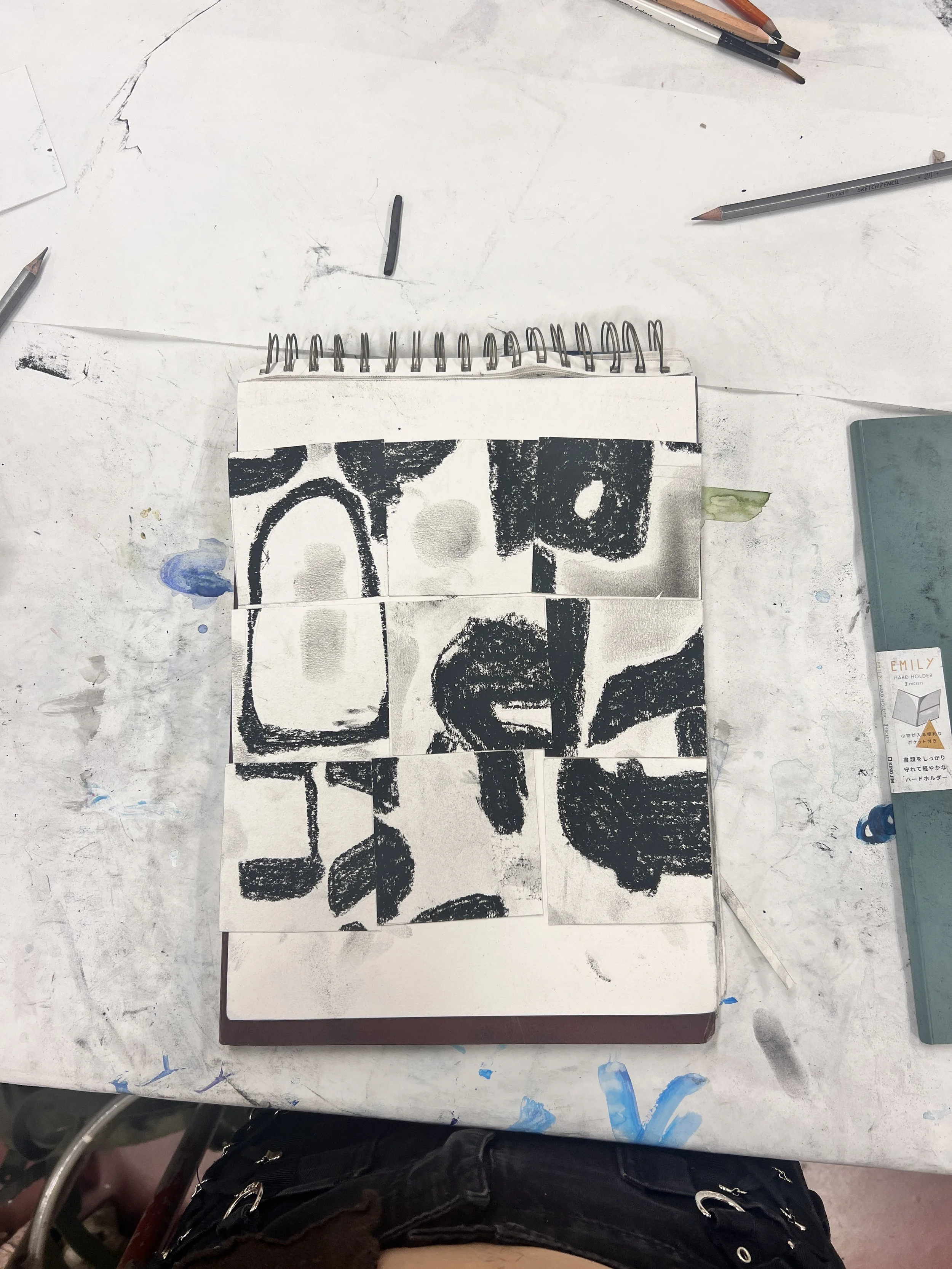 the printing process;  charcoal on paper, cardboard, ink and roller, white pastel