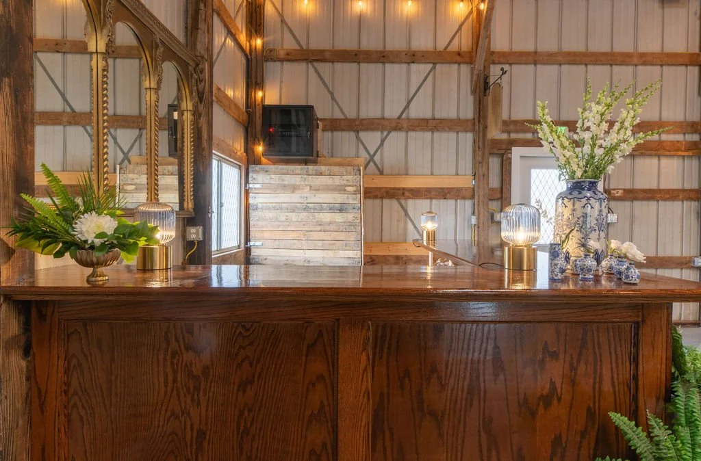 Hand-crafted oak bar inside the vintage barn at Aspen & Alston wedding venue