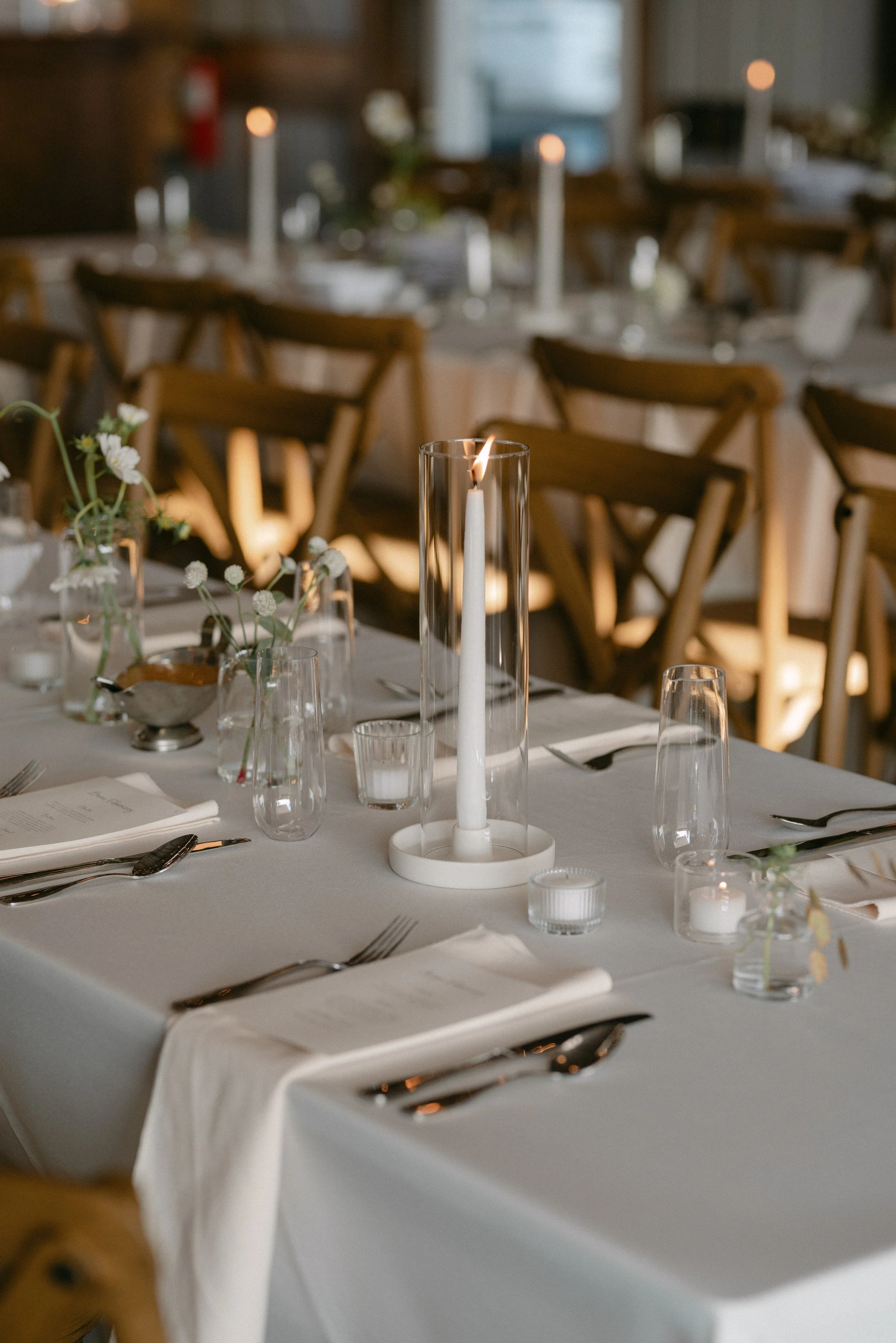 Elegant wedding table decor inside the vintage barn at Aspen & Alston