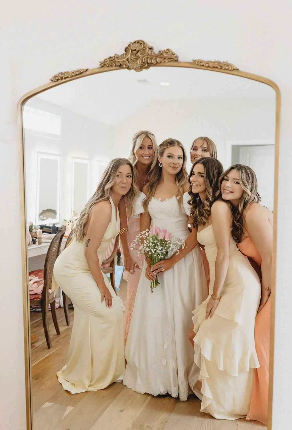 Bride with bridesmaids inside Aspen & Alston bridal suite