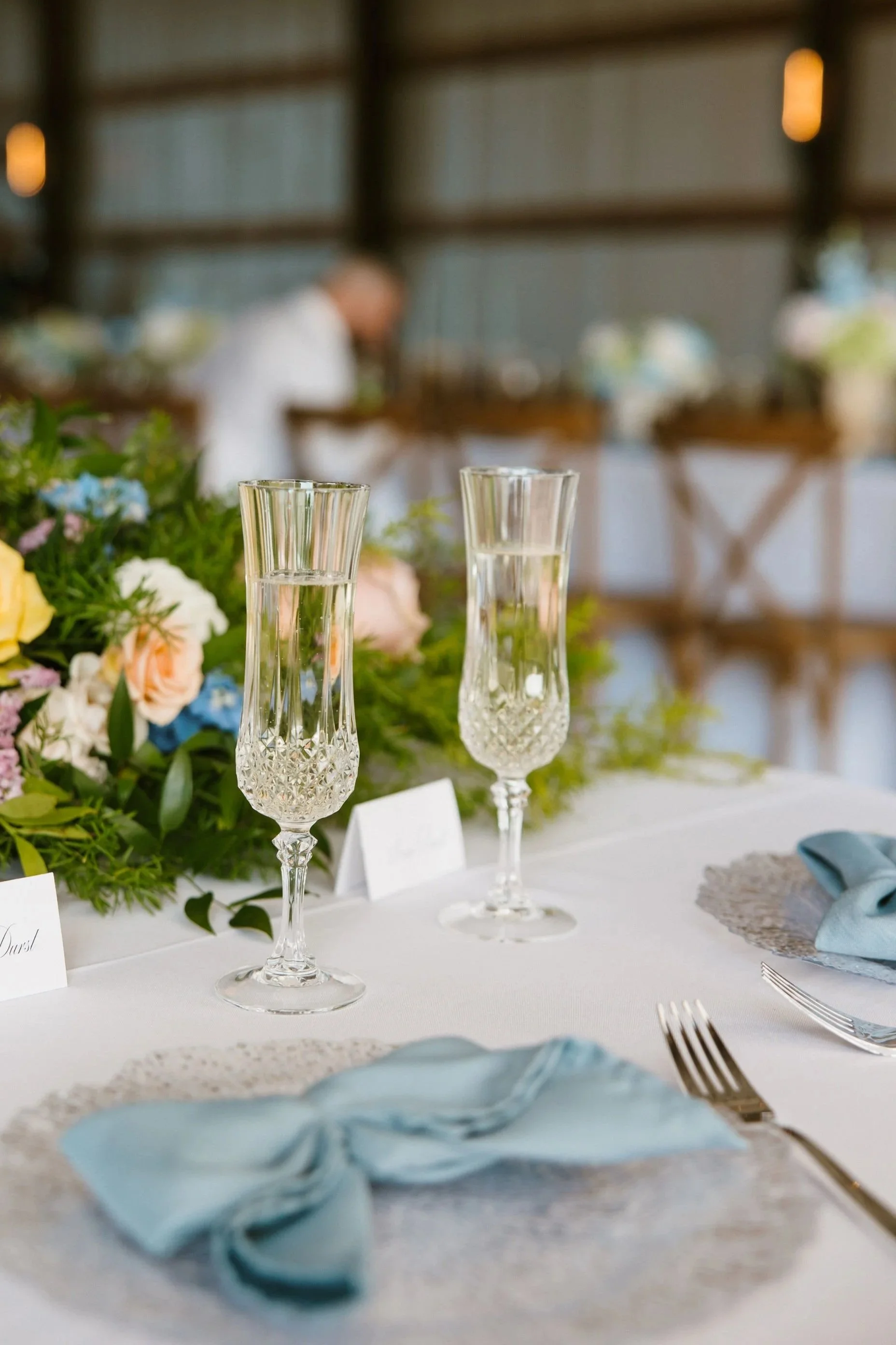Elegant reception table details inside the vintage barn at Aspen & Alston