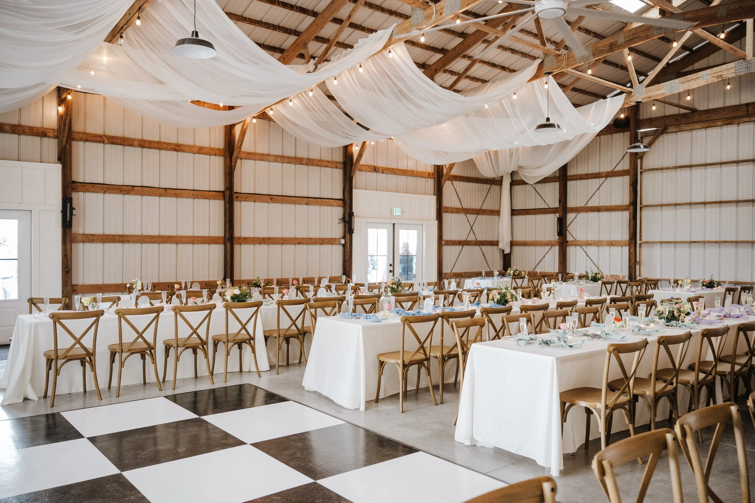 Reception setup inside the vintage barn at Aspen & Alston wedding venue near Columbus, Ohio