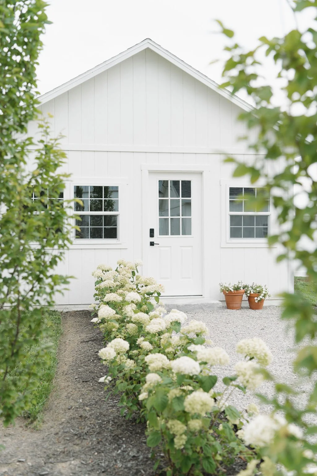 White garden-inspired barn exterior at Aspen & Alston wedding venue in Ohio