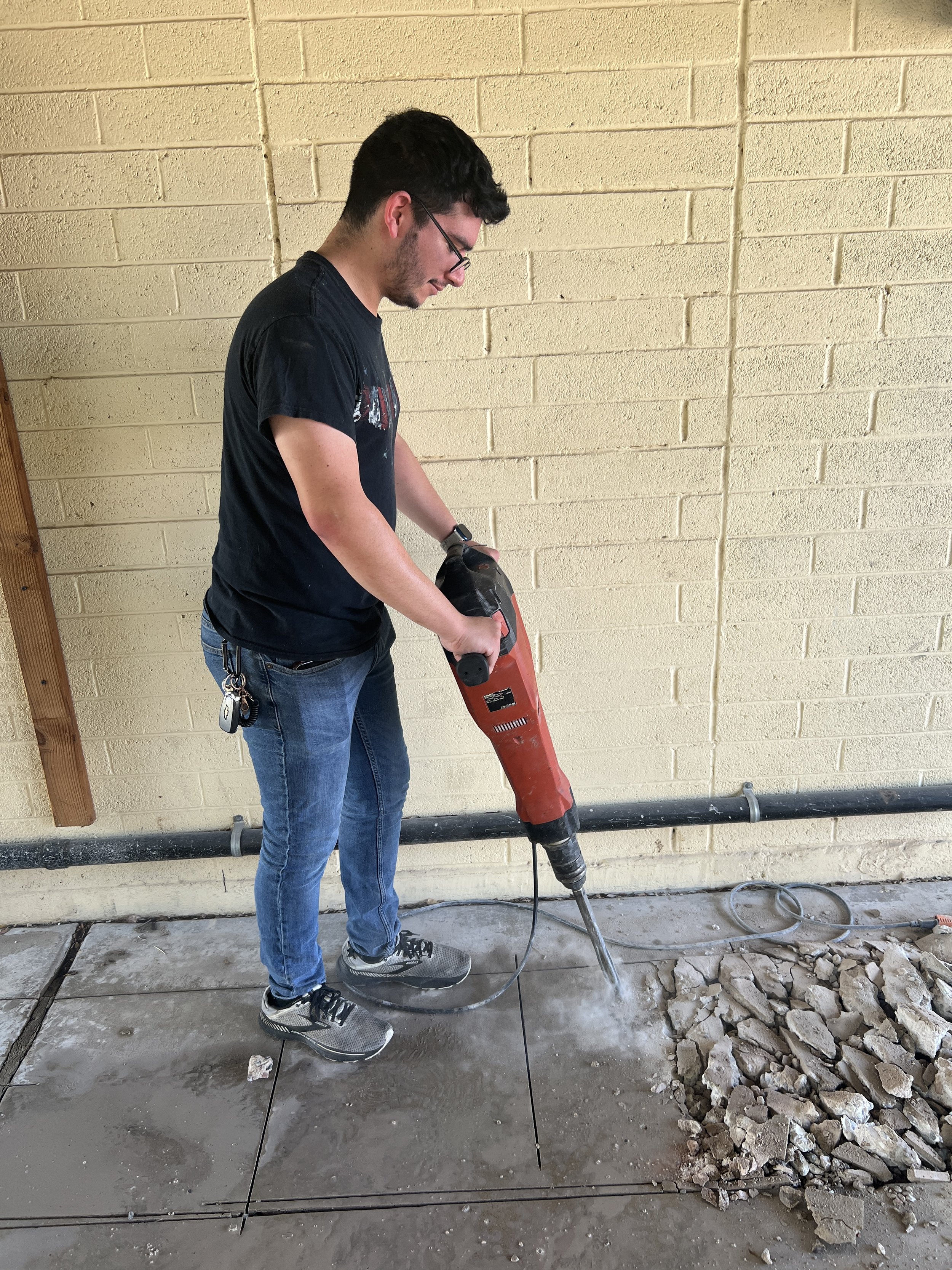 Ricardo Aguirre trying out the jackhammer