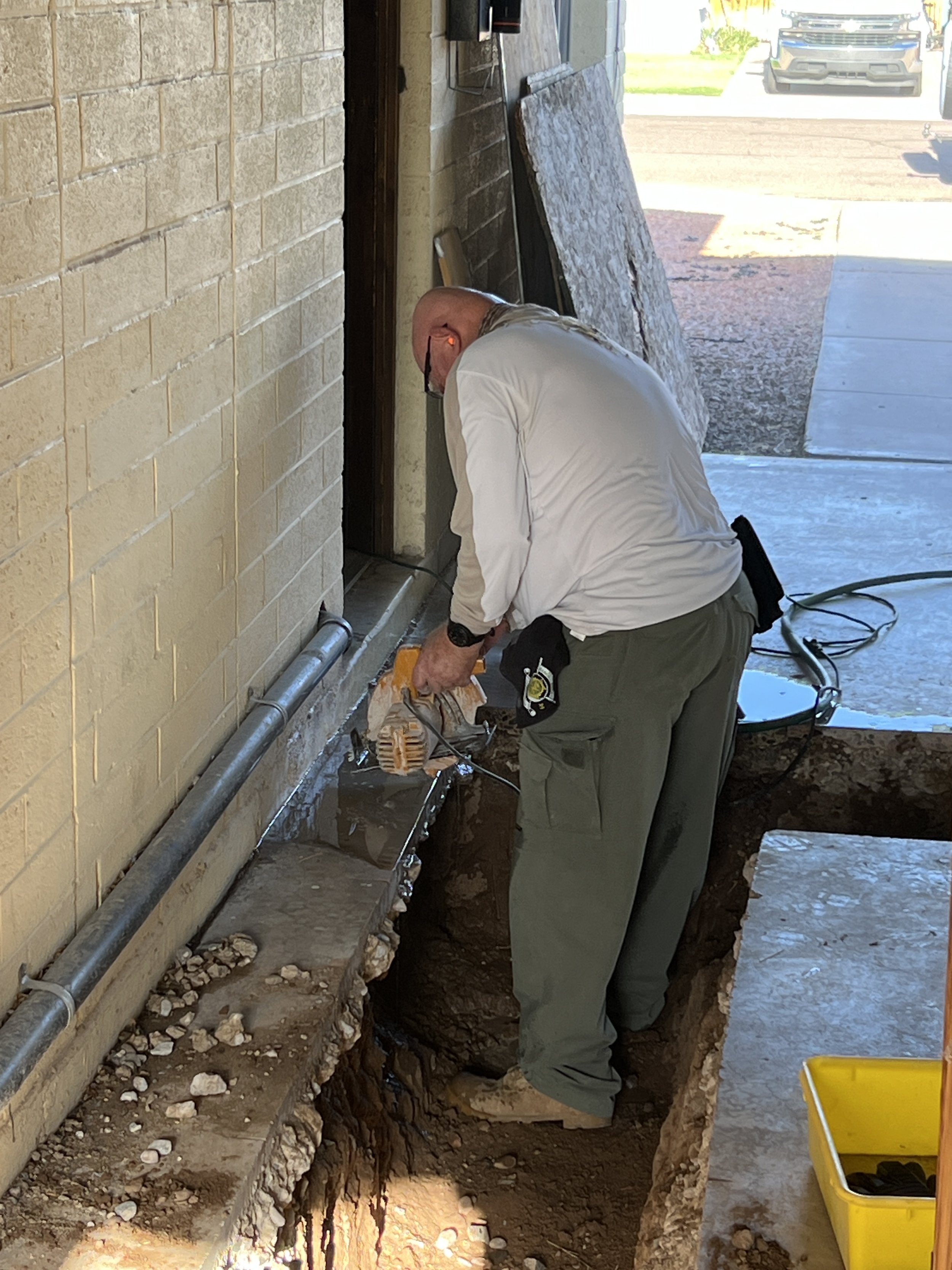 Mike Dennison cutting out the cement