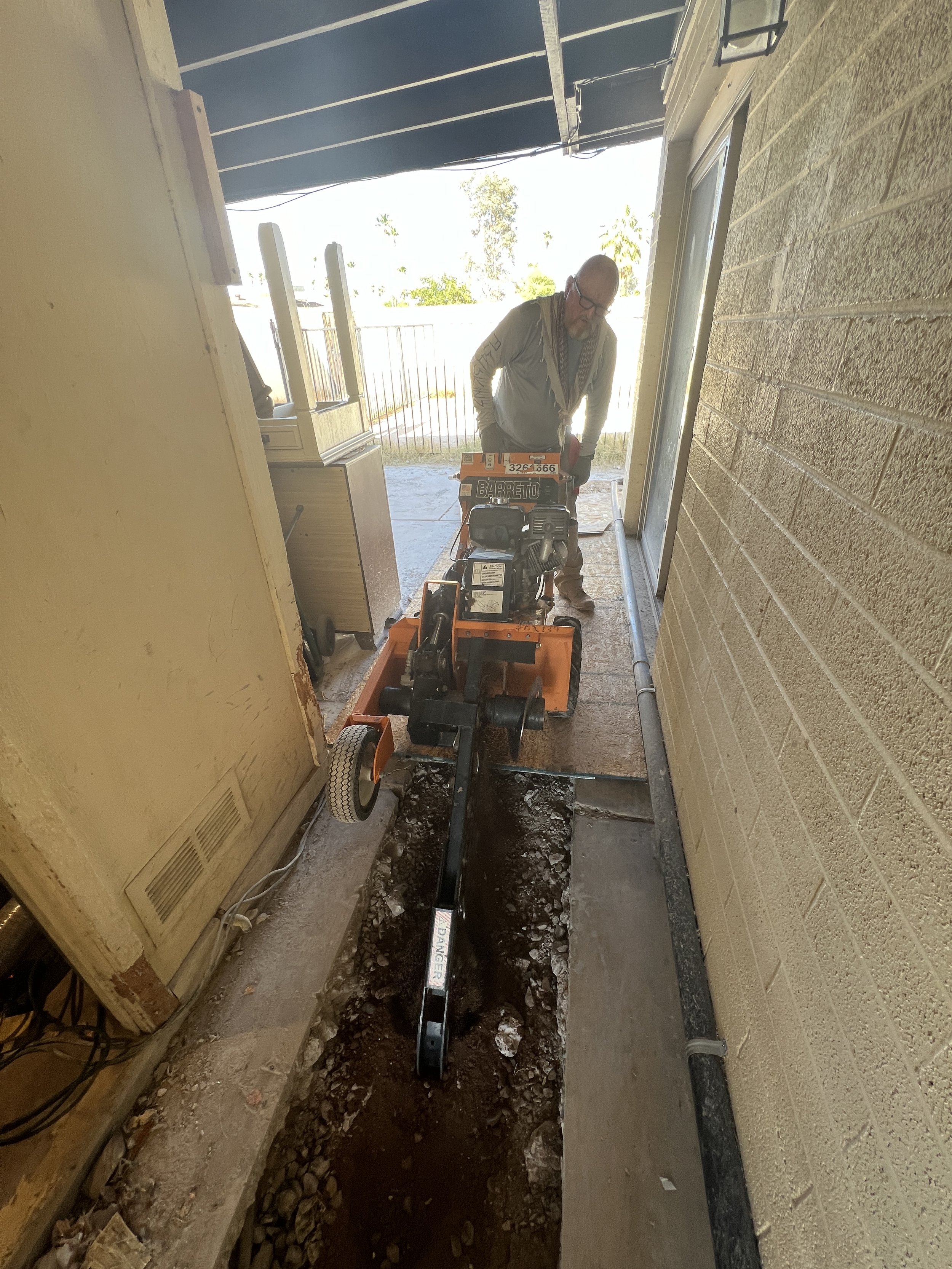 Mike Dennison handling the ditchdigger