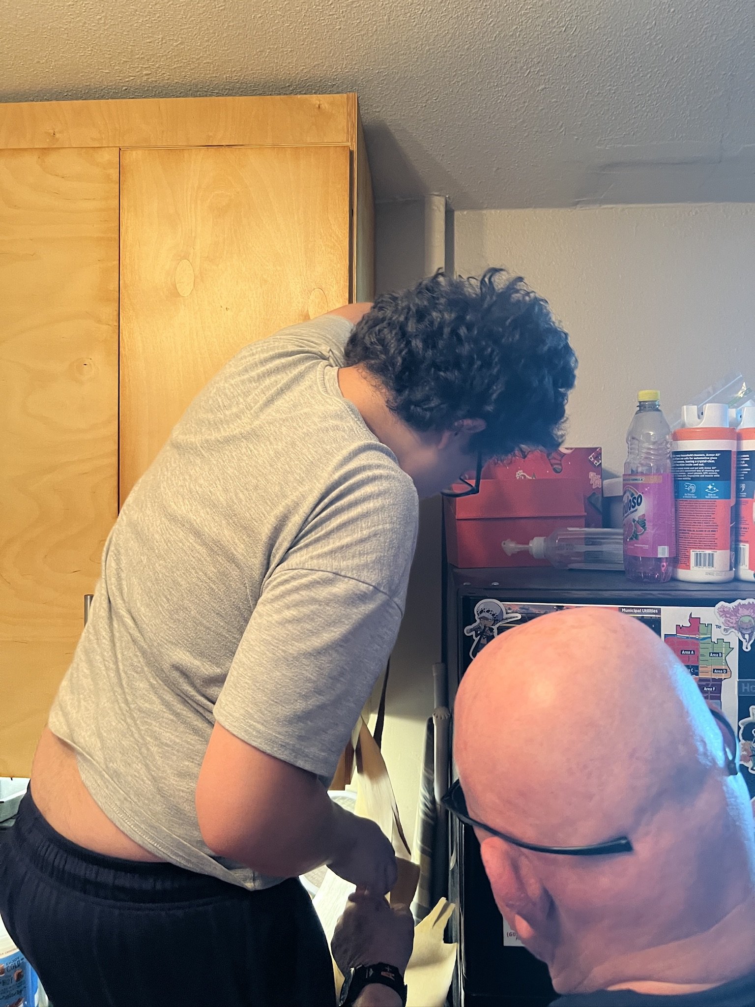 Carlos learning how to resurface cabinets