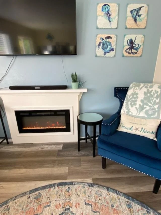 fireplace & blue chair.jpeg