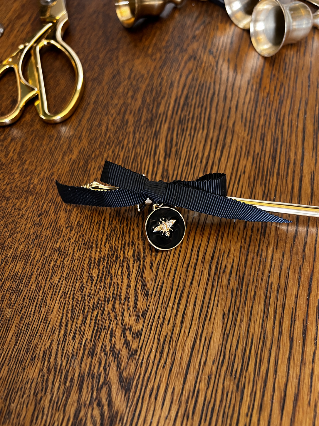 Black Ribbon Bow with Golden Bee Charm.png