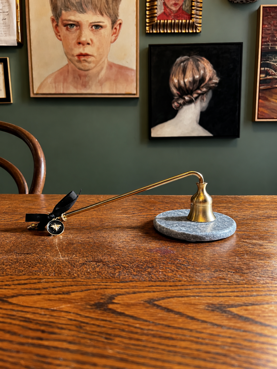Brass Snuffer Beneath a Salon Wall.png
