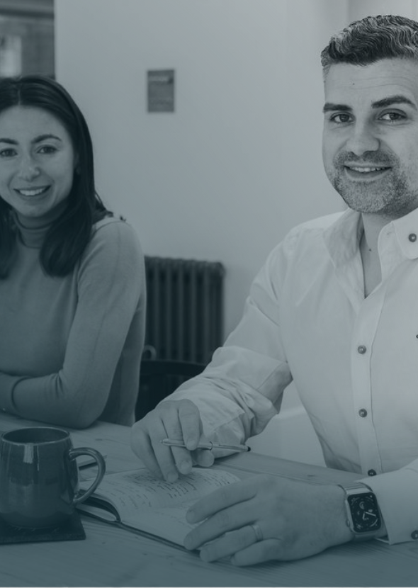 SciMed consultants reviewing clinical documentation during a regulatory consultation.
