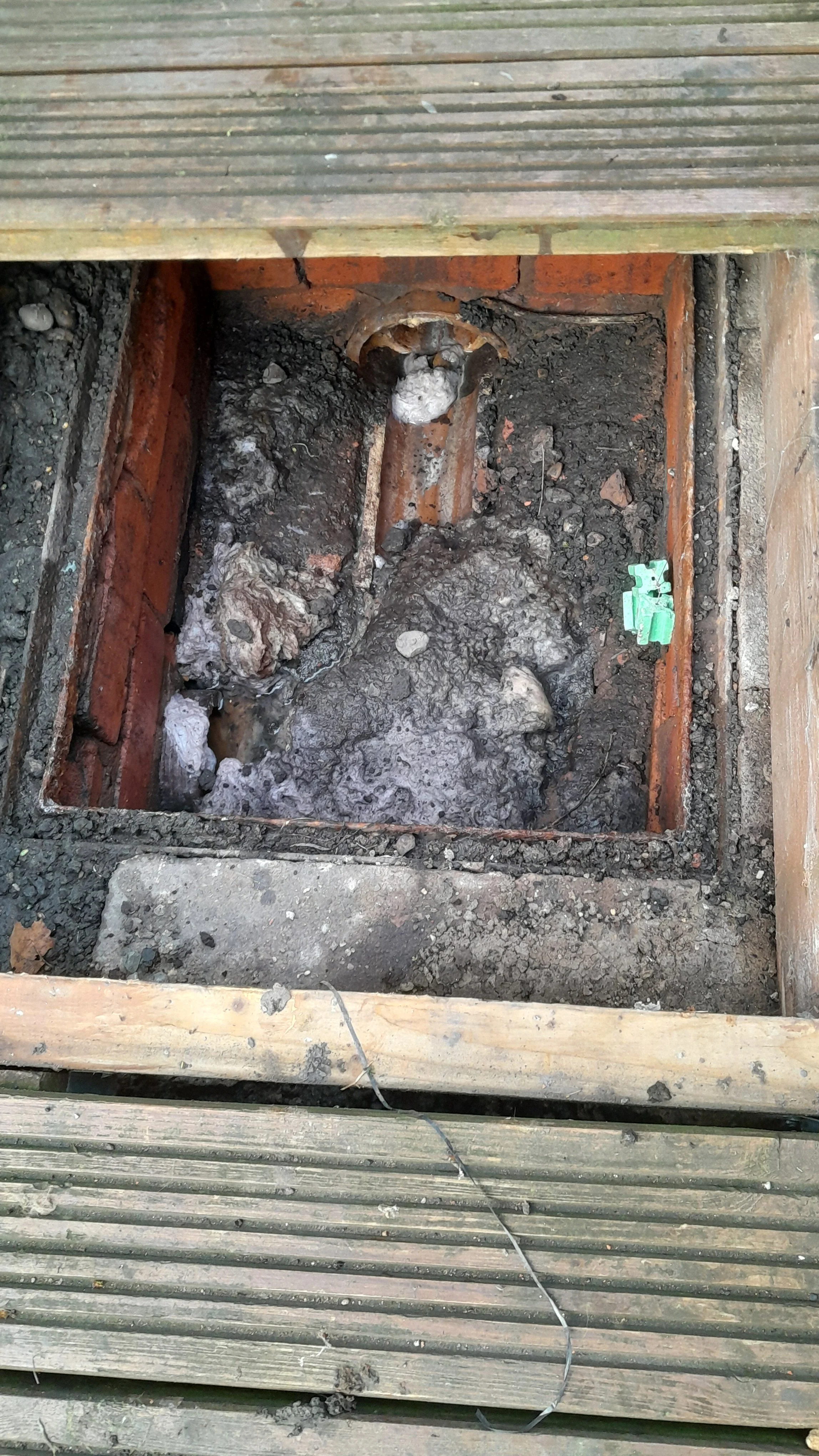 Blocked manhole ready to be cleared by high pressure water jetting