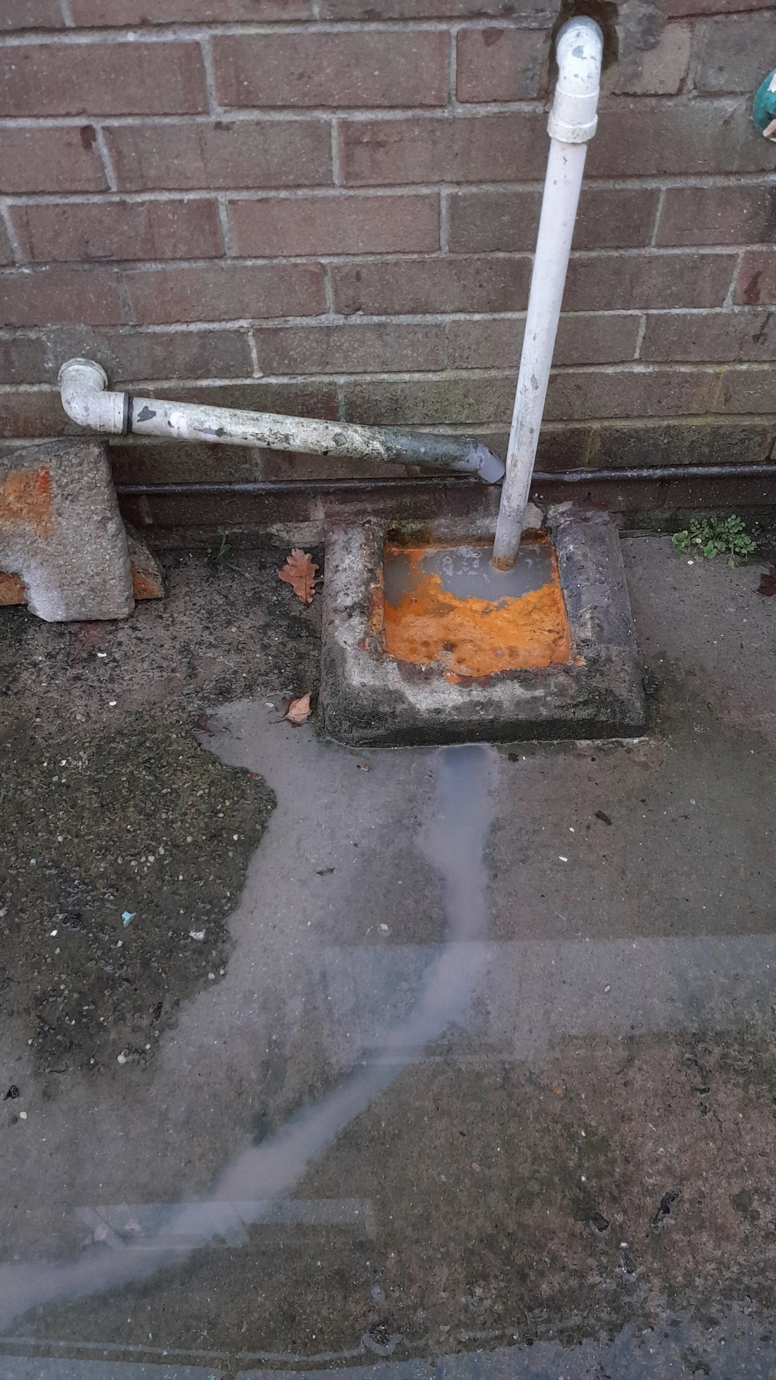 Drain unblocking has started to clear an overflowing gulley at the rear of the house.