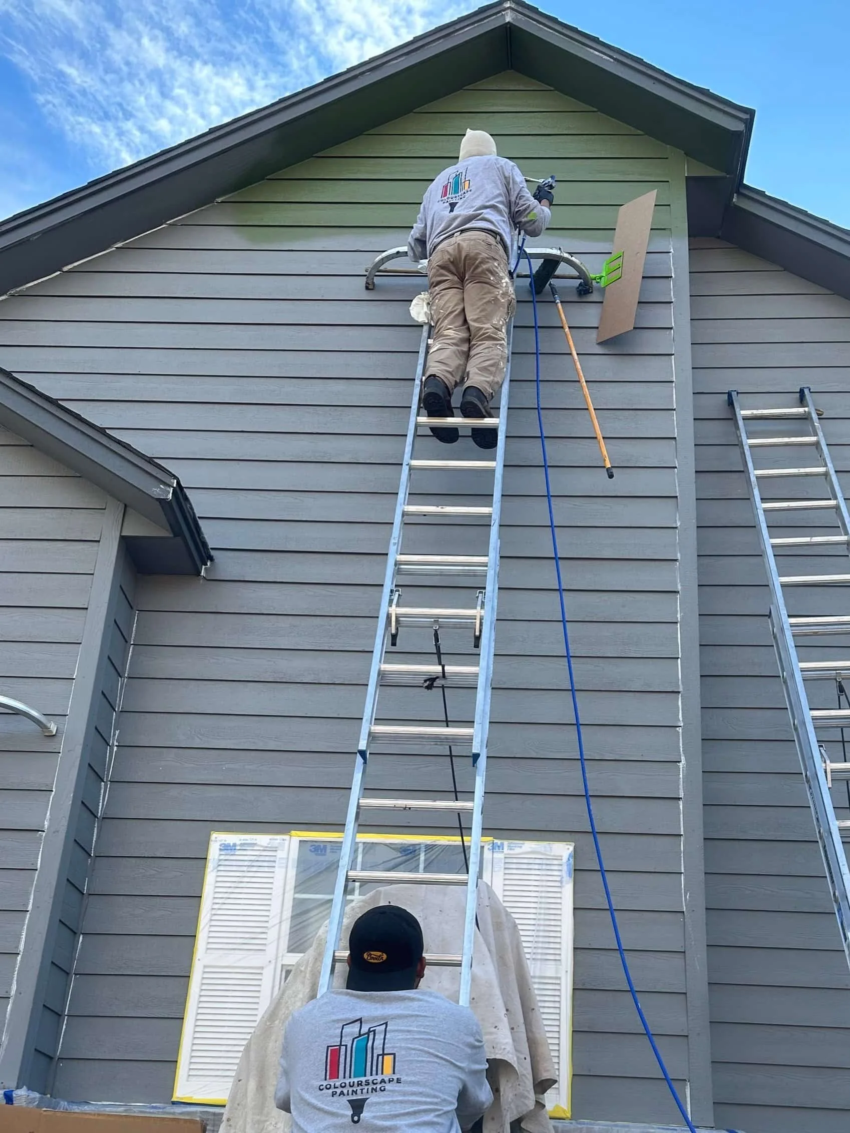 Exterior Painting in Reno being done by 2 colourscape painting team members.
