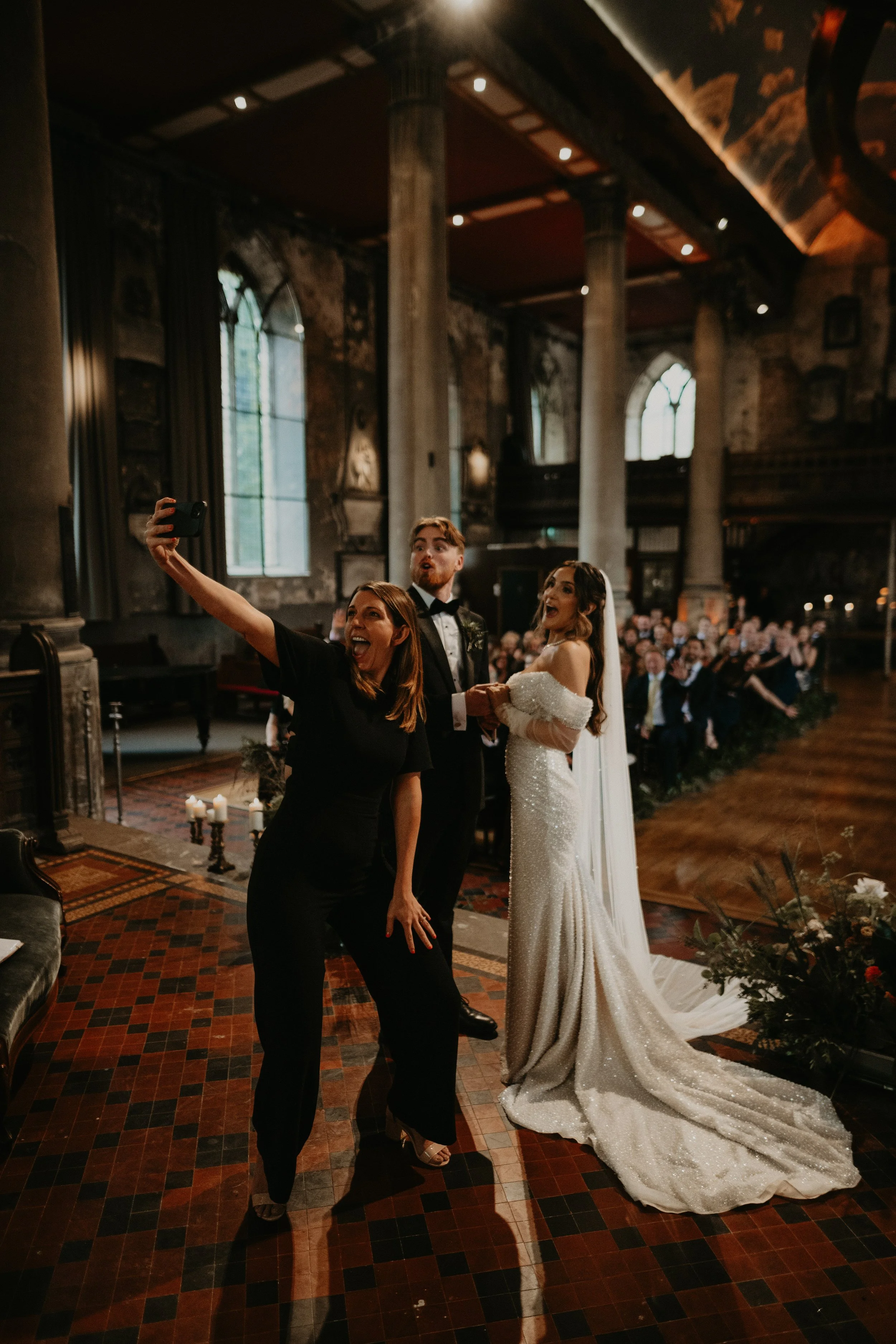 Celebrant taking a selfie of the couple and their guests during their wedding celebrant-ledwedding ceremony at The Mount Without, Bristol