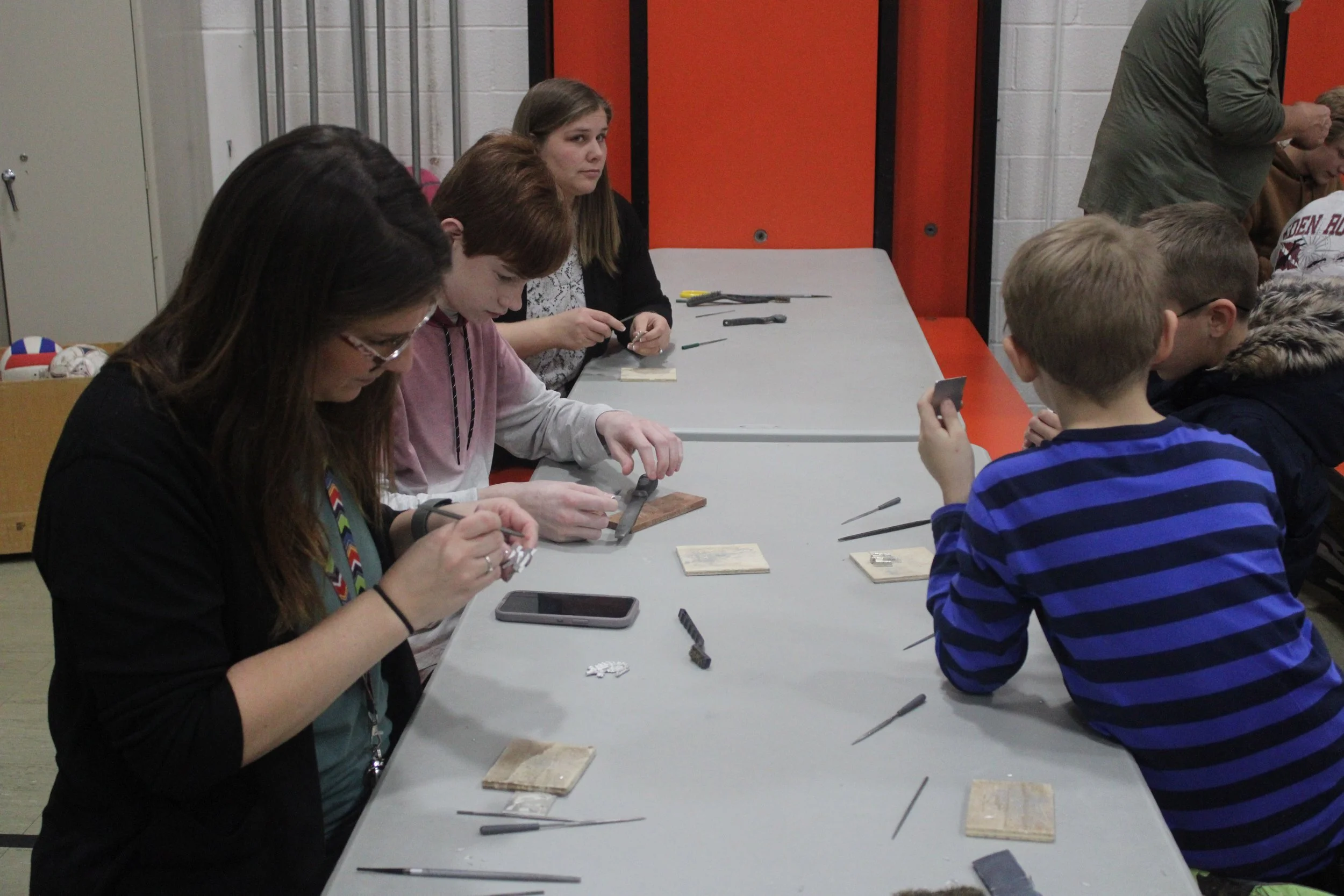 students polishing casting