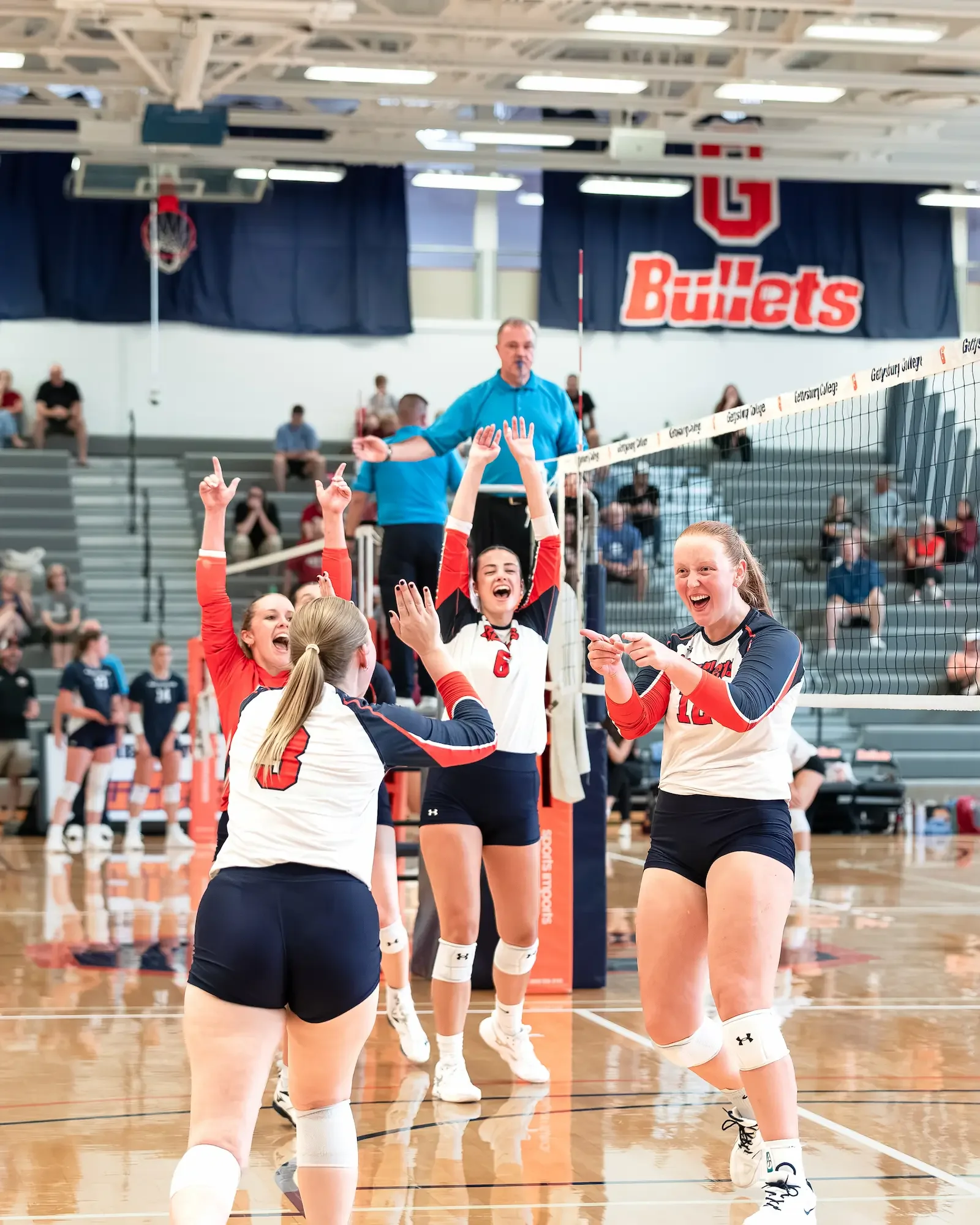 Gettysburg College volleyball team celebrating win over Marymount.