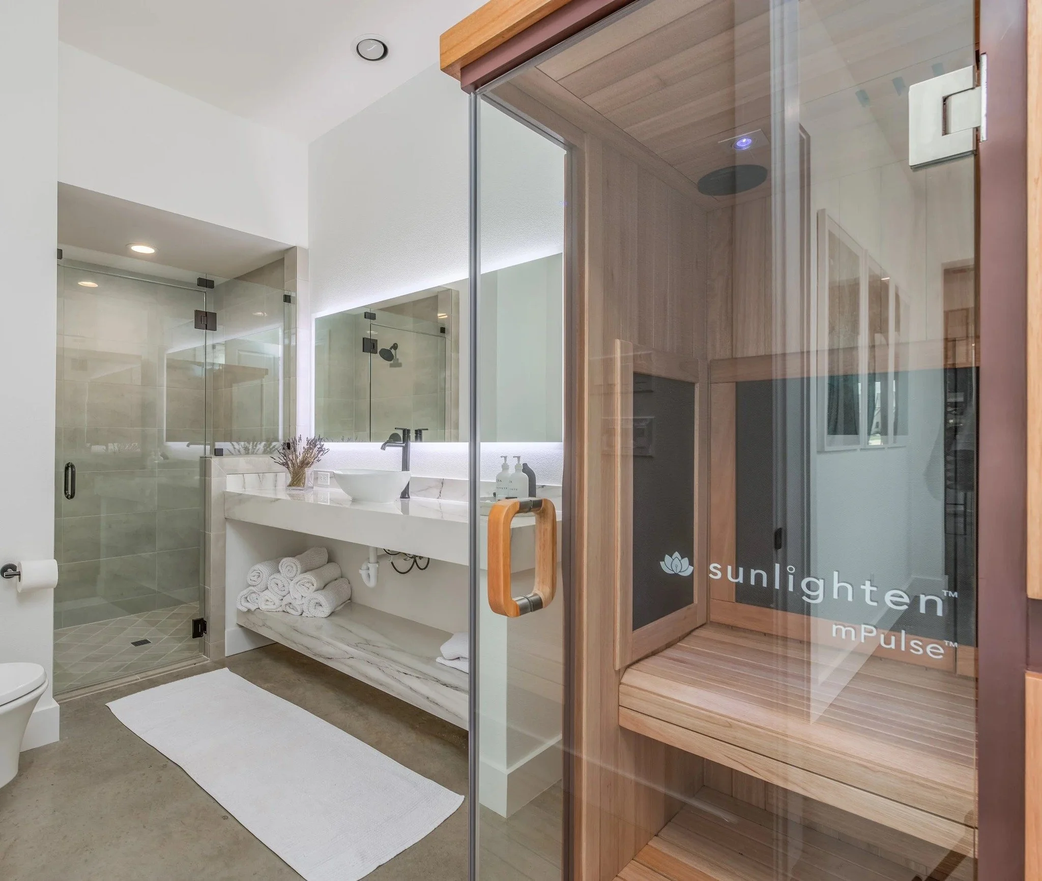 Where the day begins and ends in ease.
Every detail considered for how it feels.

Natural light. Clean lines. A space built to restore. Even the private sauna was intentionally integrated. Because when we say custom, we mean custom!