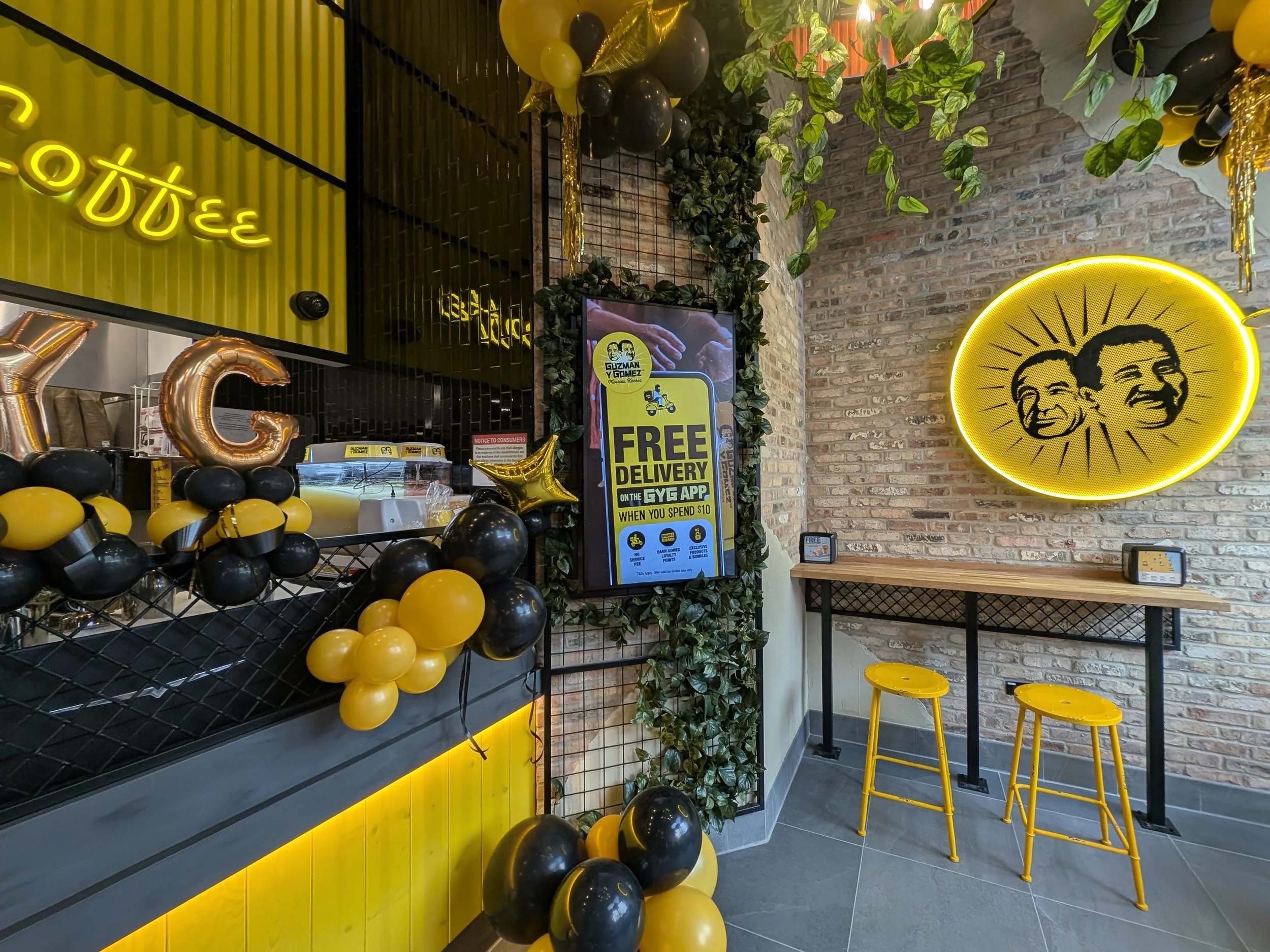 Mesh display paneling and yellow wall panels by Vero for GYG Bucktown