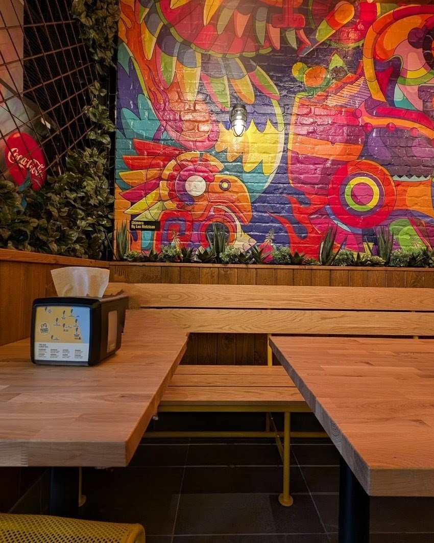 Custom wood bench with yellow steel frame, fabricated by Vero for Guzman Y Gomez Bucktown