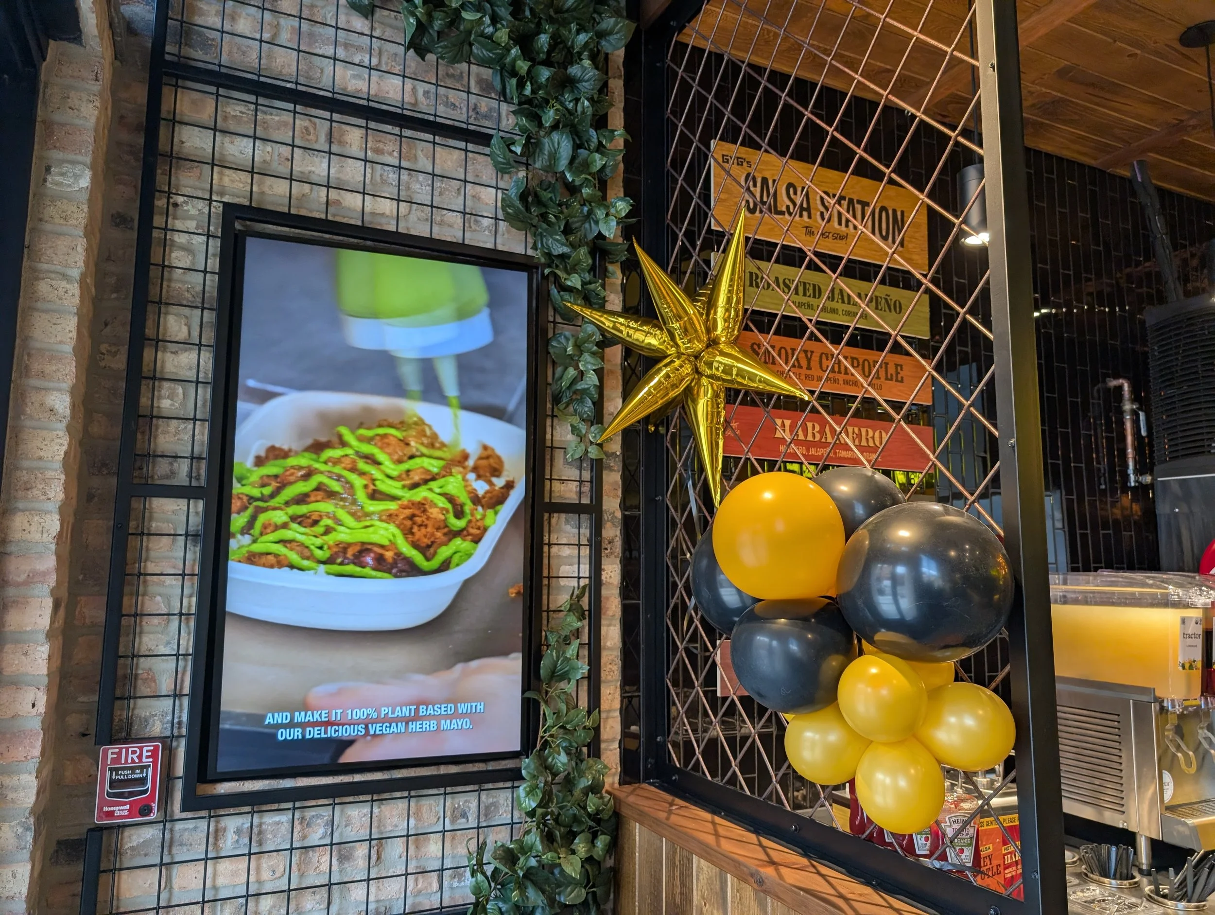 Steel mesh wall panel and room divider at GYG Bucktown, built by Vero