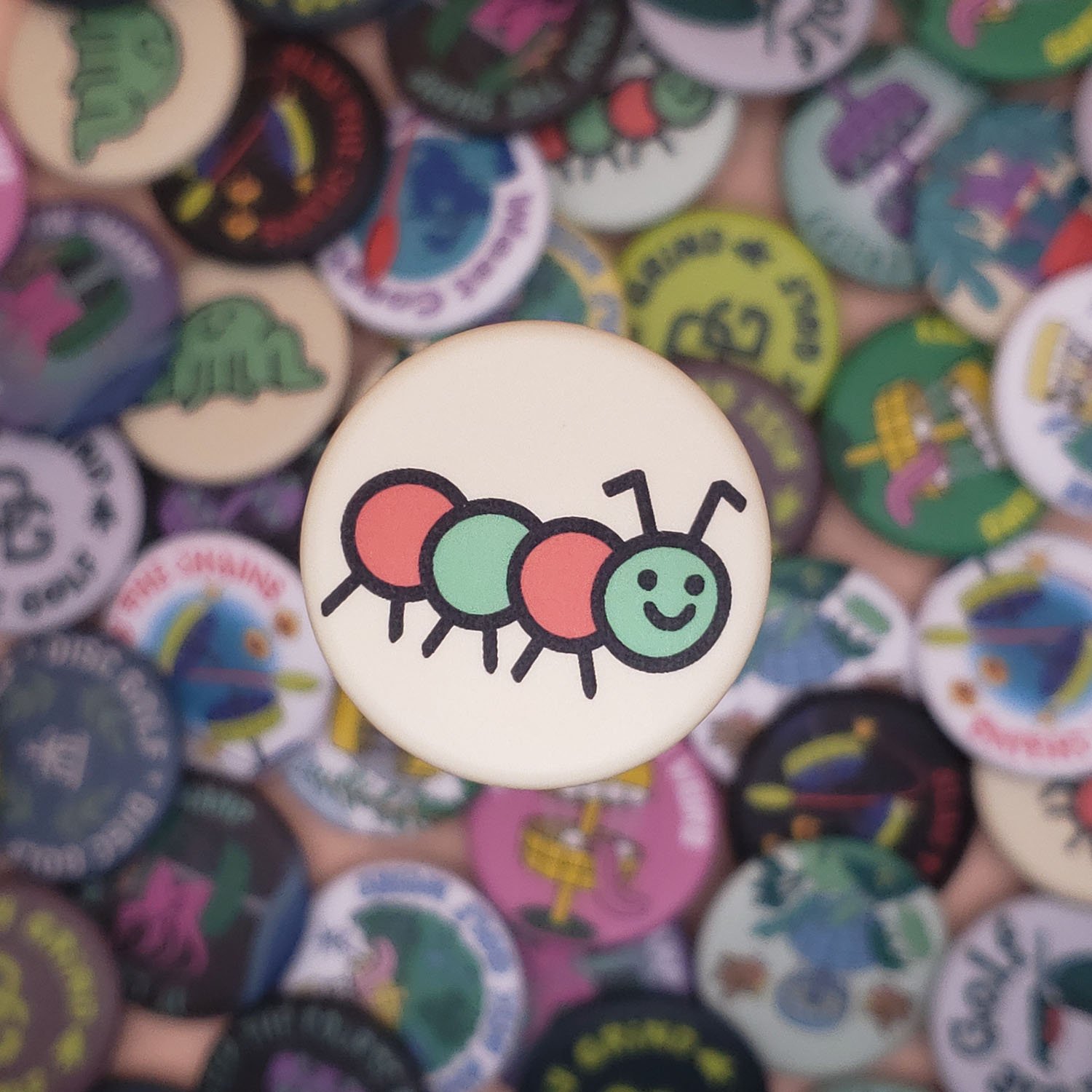 Caterpillar-Cream-Disc-Golf-Button (small).jpg