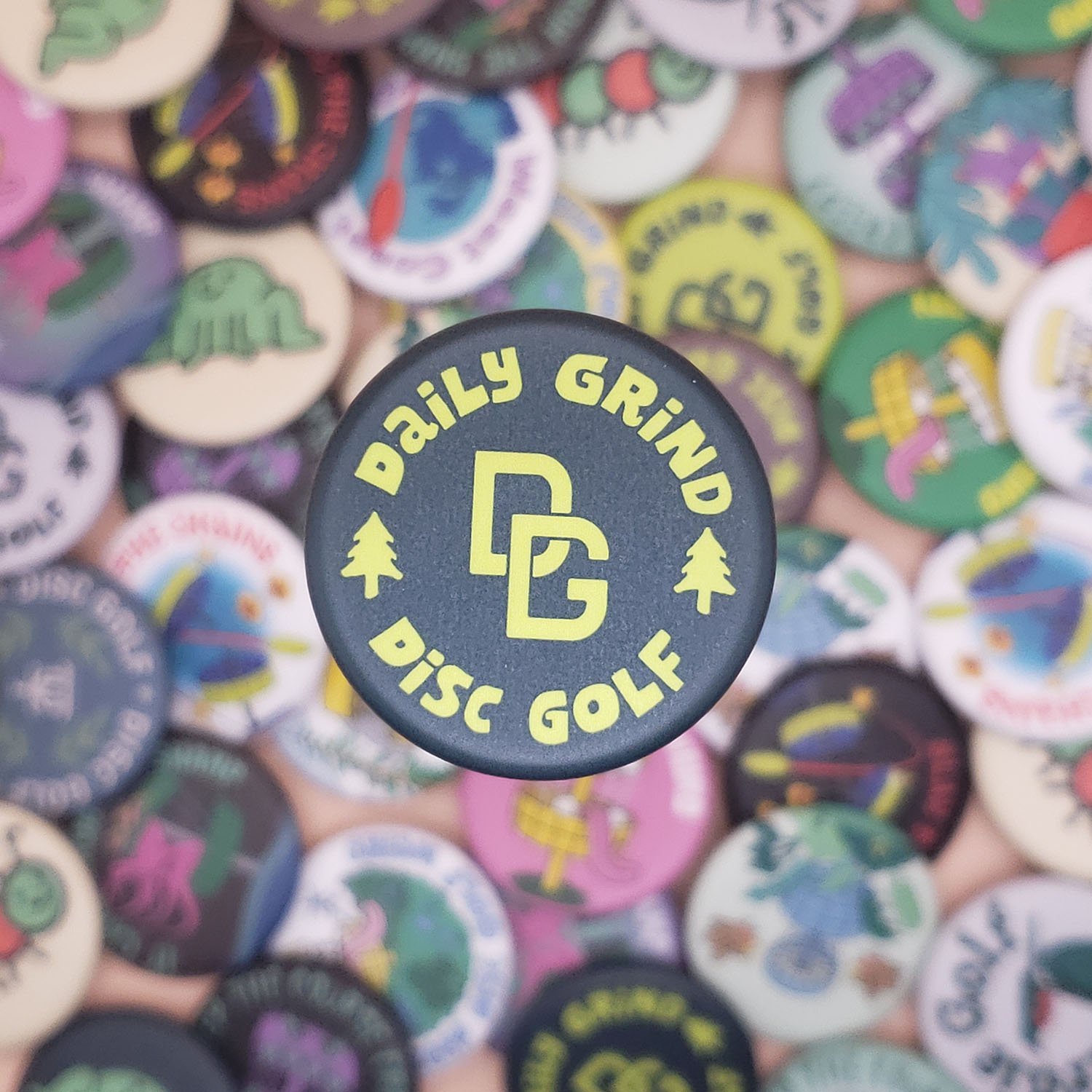 Daily-Grind-Logo-Dark-Green-Disc-Golf-Button (small).jpg