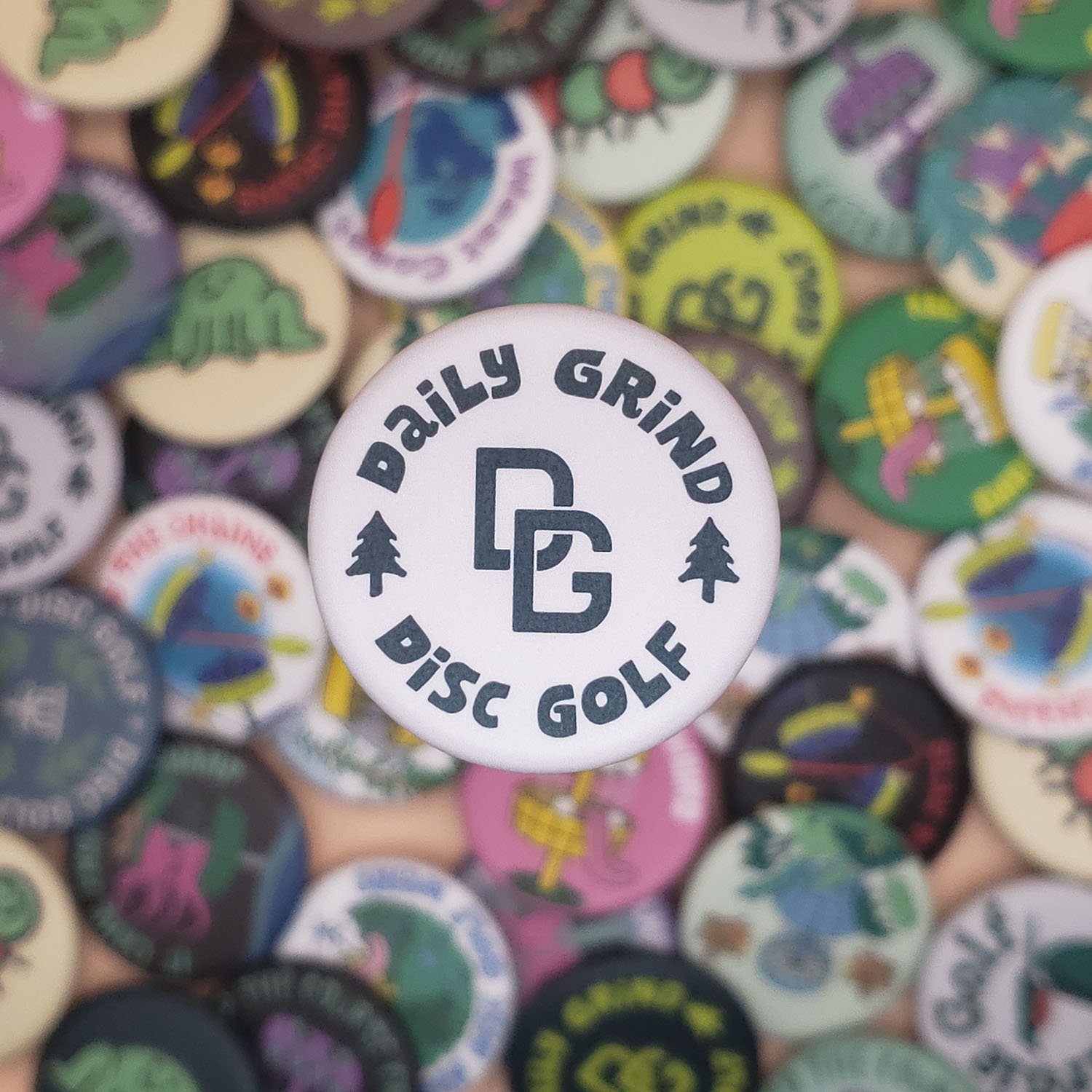 Daily-Grind-Logo-Gray-Disc-Golf-Button (small).jpg