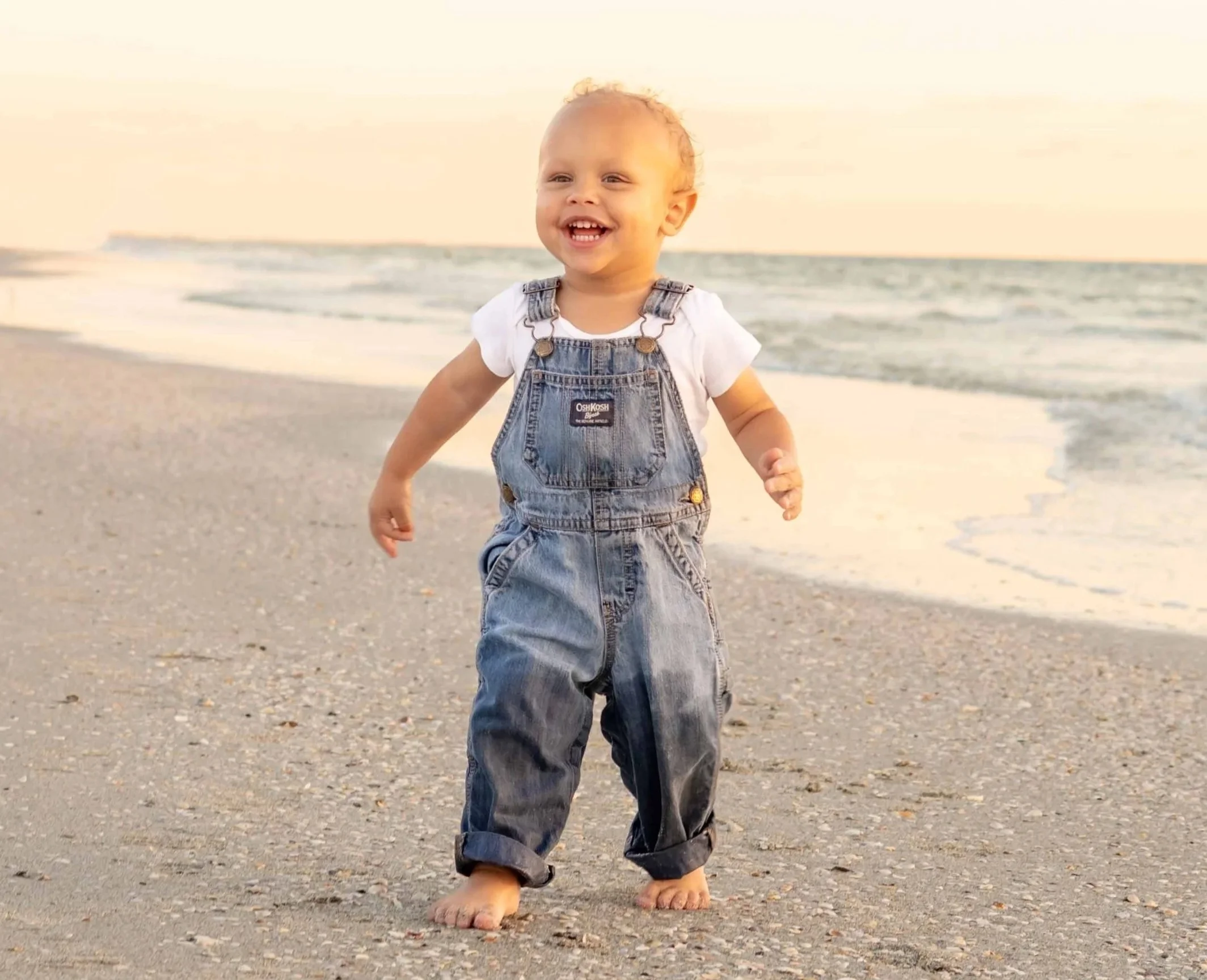 st-pete-florida-family-beach-sunset-toddler-boy-walk.jpg