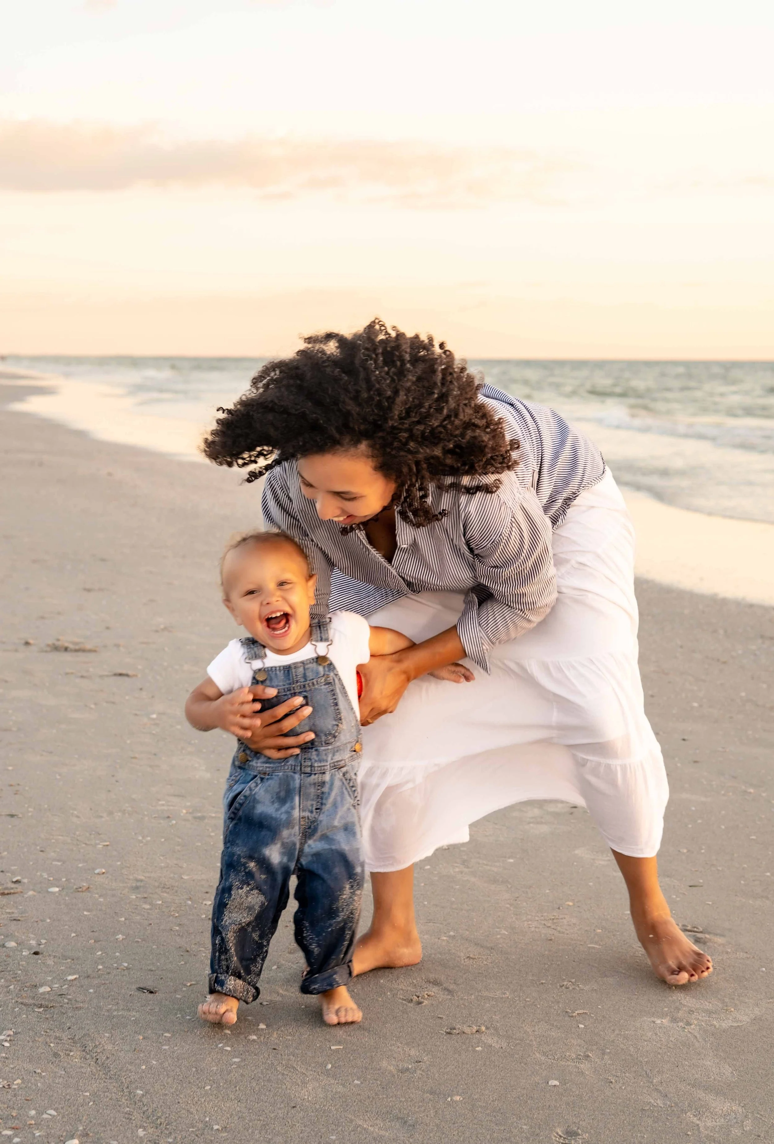 st-pete-florida-family-beach-sunset-mom-and-toddler-play-laugh.jpg