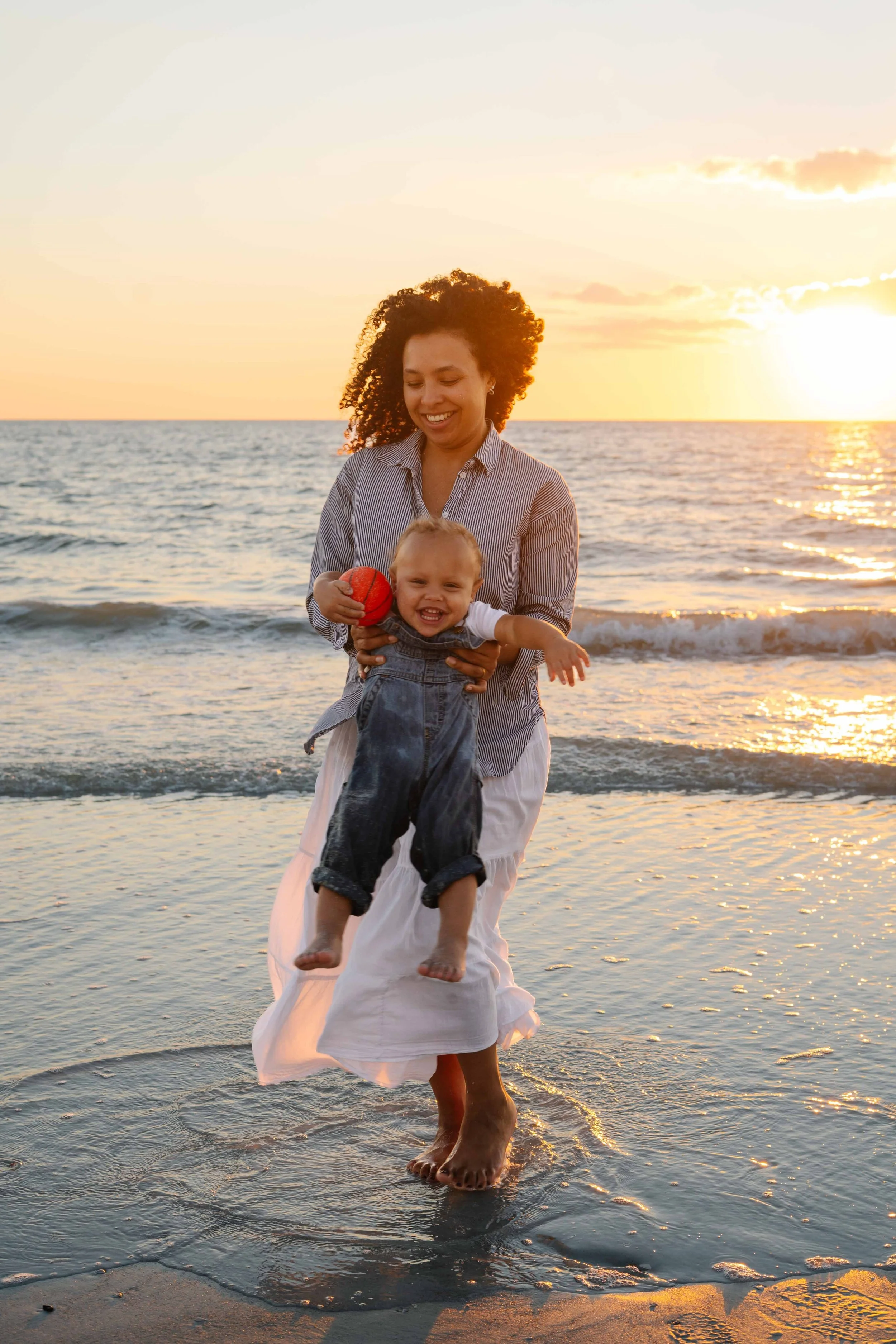 st-pete-florida-family-beach-sunset-mom-catch-toddler-boy.jpg