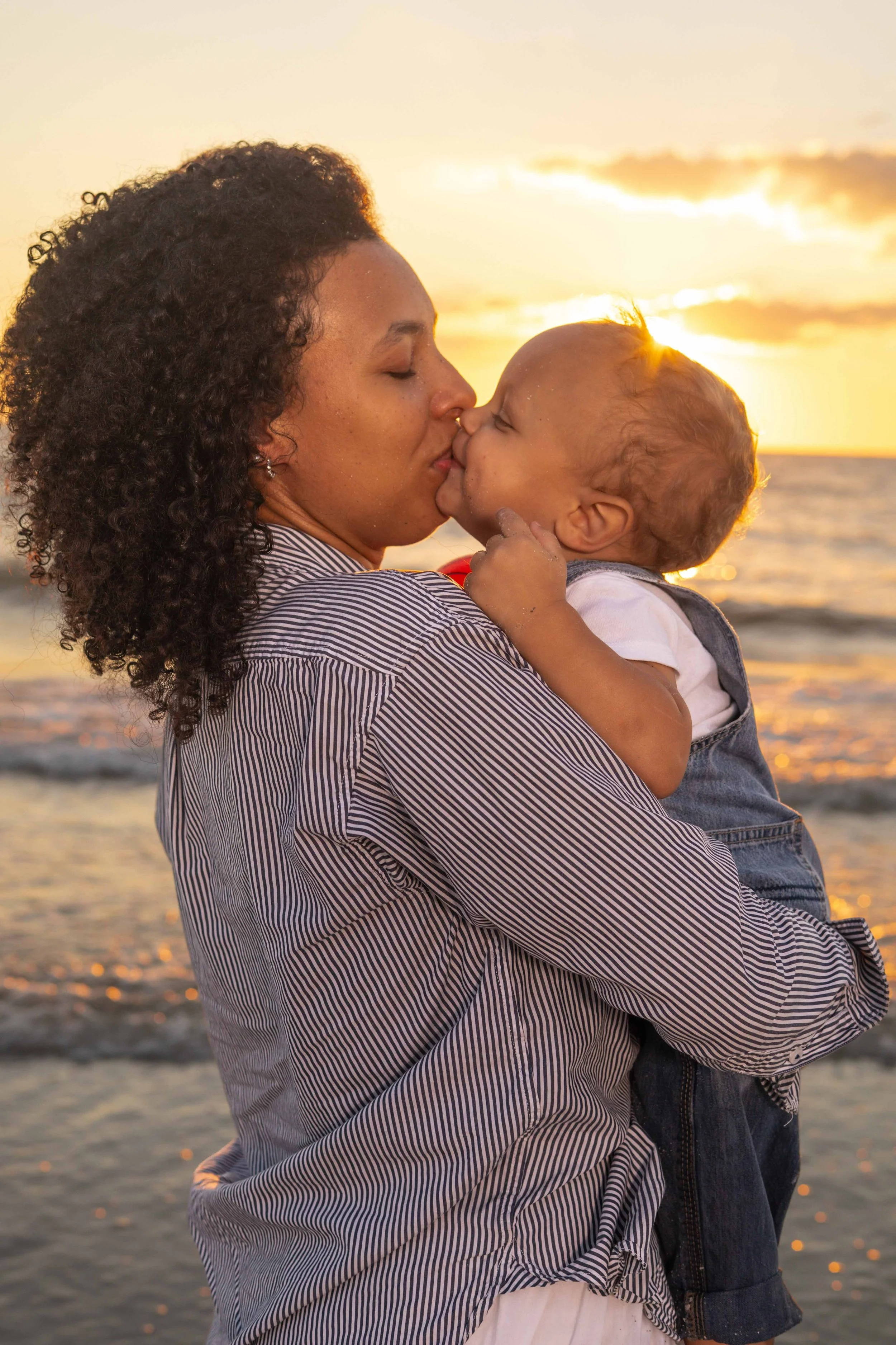 st-pete-florida-family-beach-sunset-mom-kiss-toddler-boy.jpg
