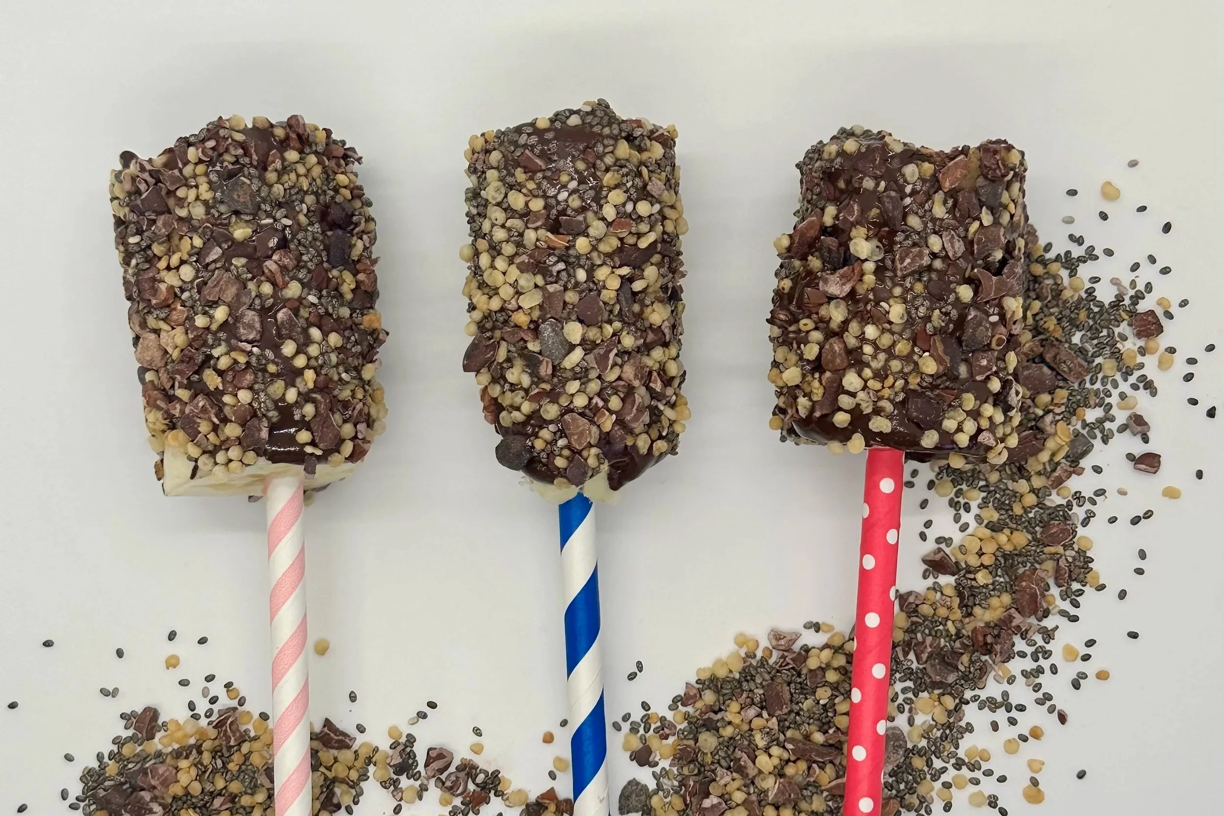Frozen chocolate dipped bananas rolled in TOP'T cacao crunch