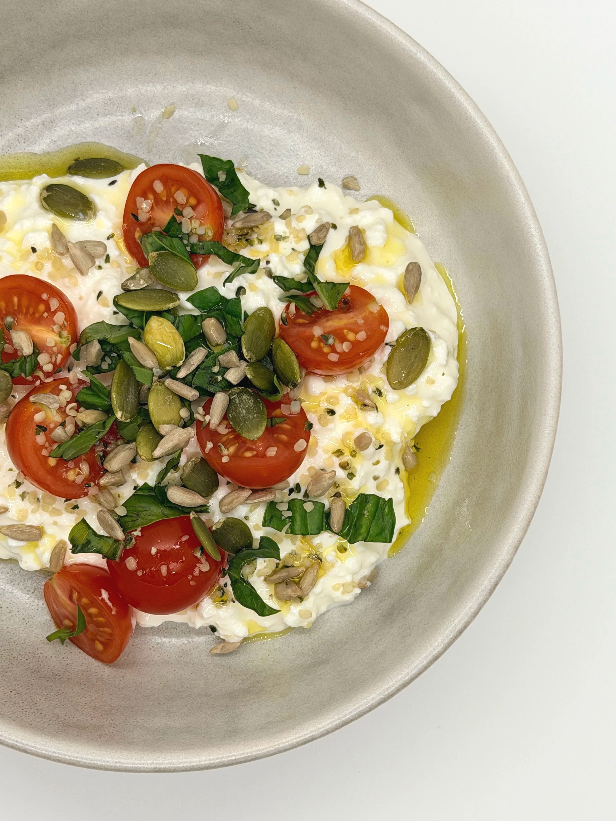 Cottage cheese with tomatoes, basil, EVOO and TOP'T Seed Mix.